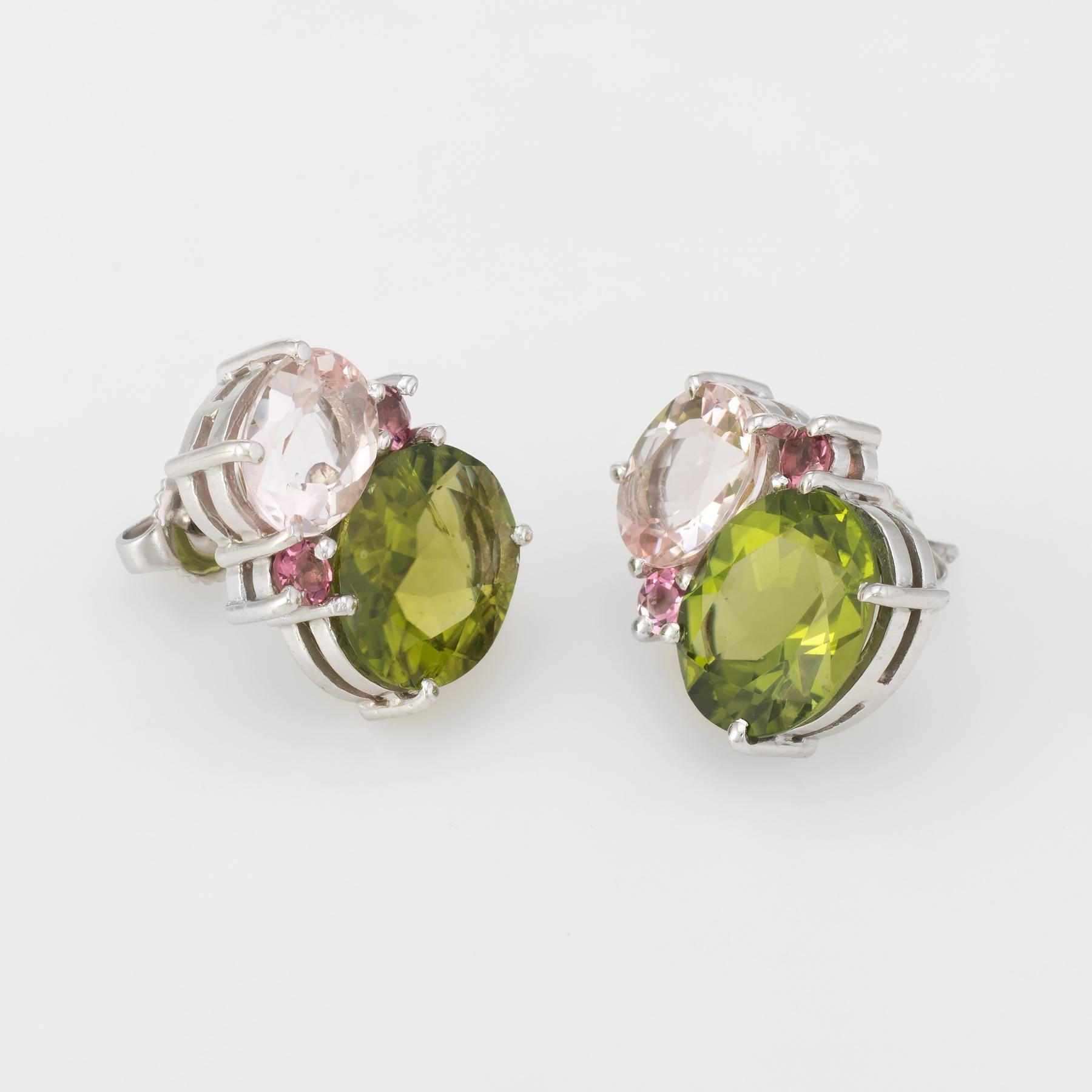 Finely detailed pair of estate earrings, crafted in 18k white gold.  Pre Owned

Peridot measures 12mm x 10mm (estimated at 4 carats each - 8 carats total estimated weight), accented with pink tourmalines that measures 9mm x 7mm (estimated at 2.50