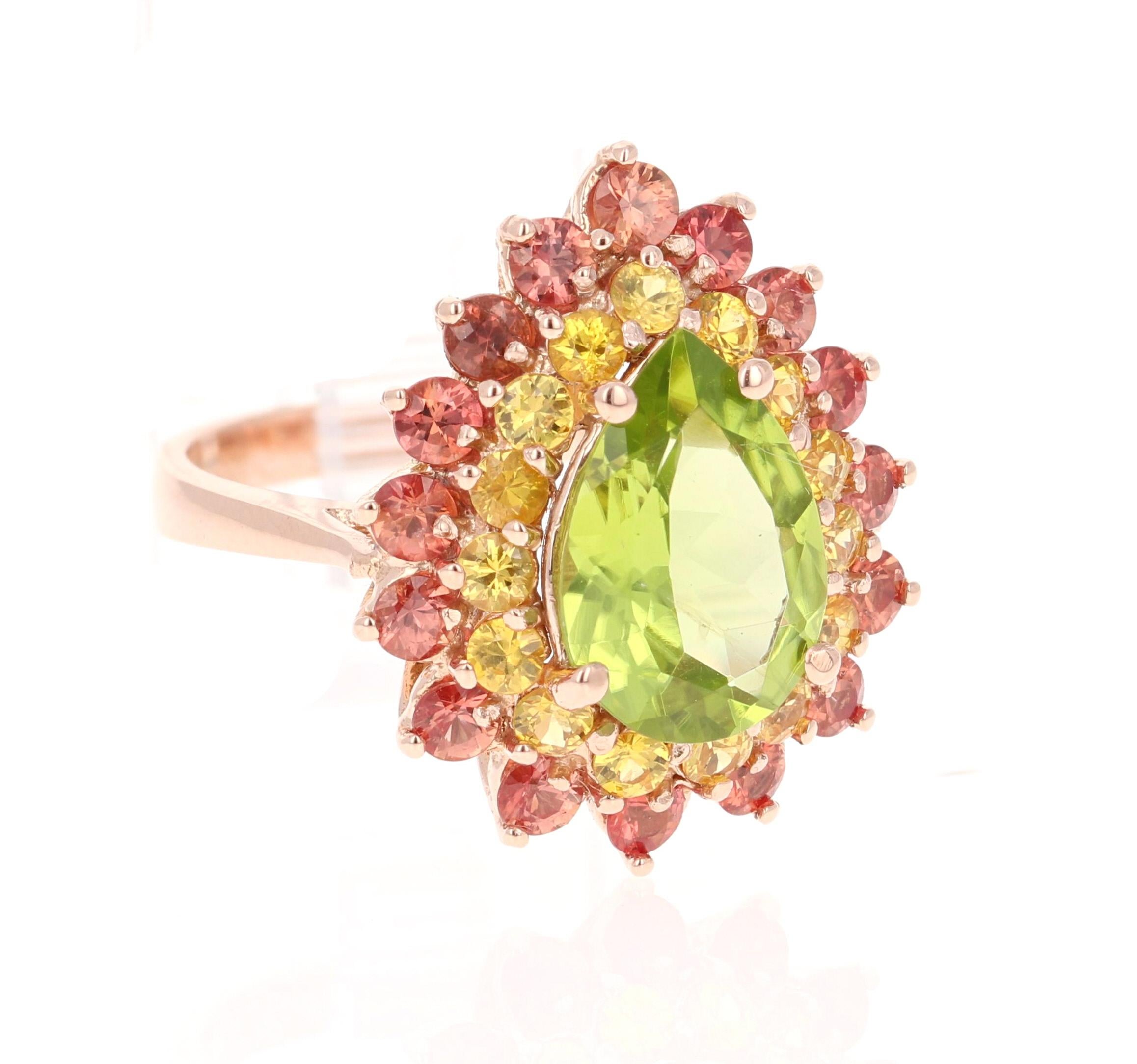 4.76 Carat Natural Peridot Red and Yellow Sapphire Rose Gold Cocktail Ring

This beautiful ring has a Pear Cut Peridot in the center that weighs 2.61 carats. The first halo is of 15 Yellow Sapphires that weigh 0.88 carats and the second halo is of