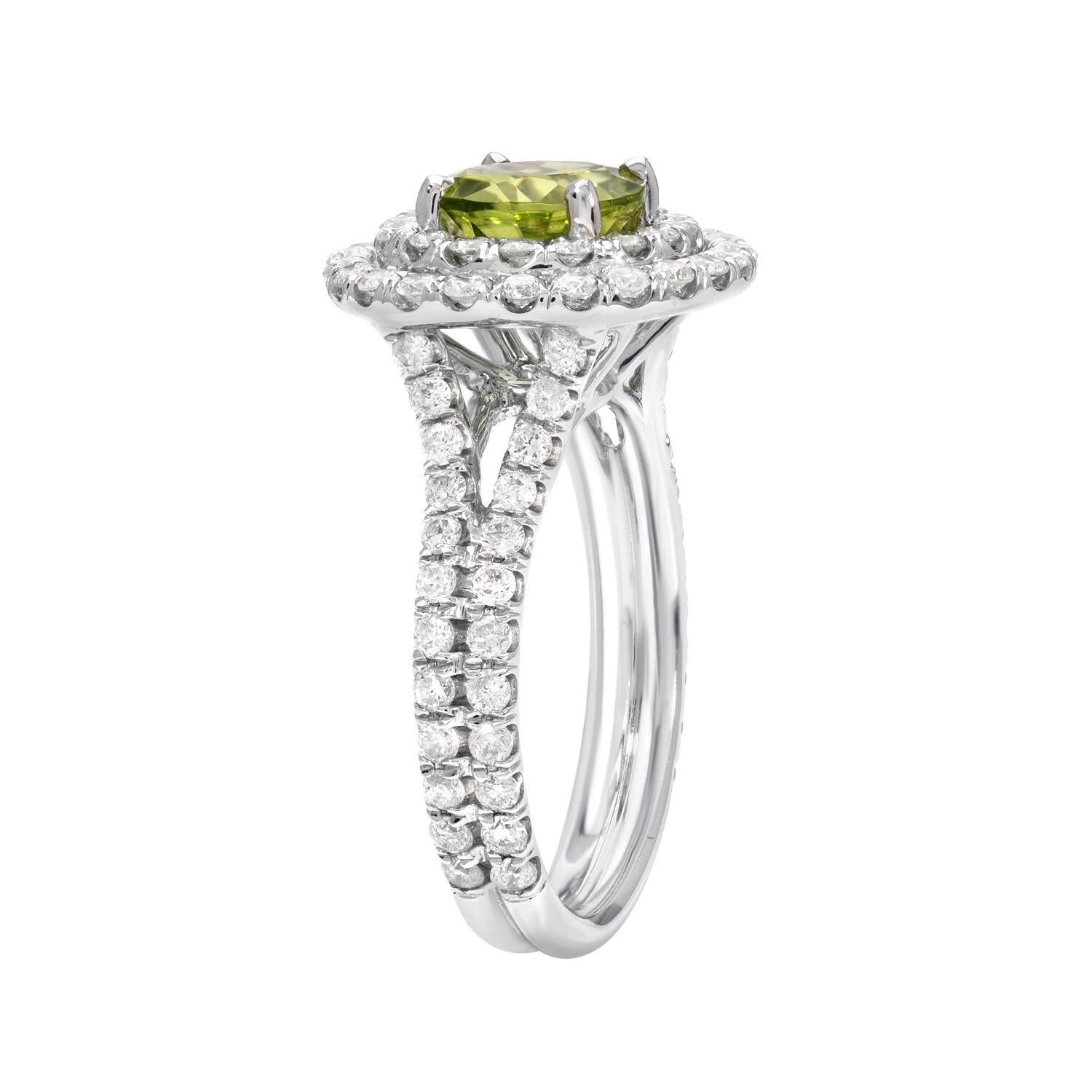 18K white gold ring set with a very desirable 1.41 carat round Peridot, decorated with a total of 0.93 carat round brilliant diamonds.
Ring size 5.25. Re-sizing is complementary upon request.
Returns are accepted and paid by us within 7 days of