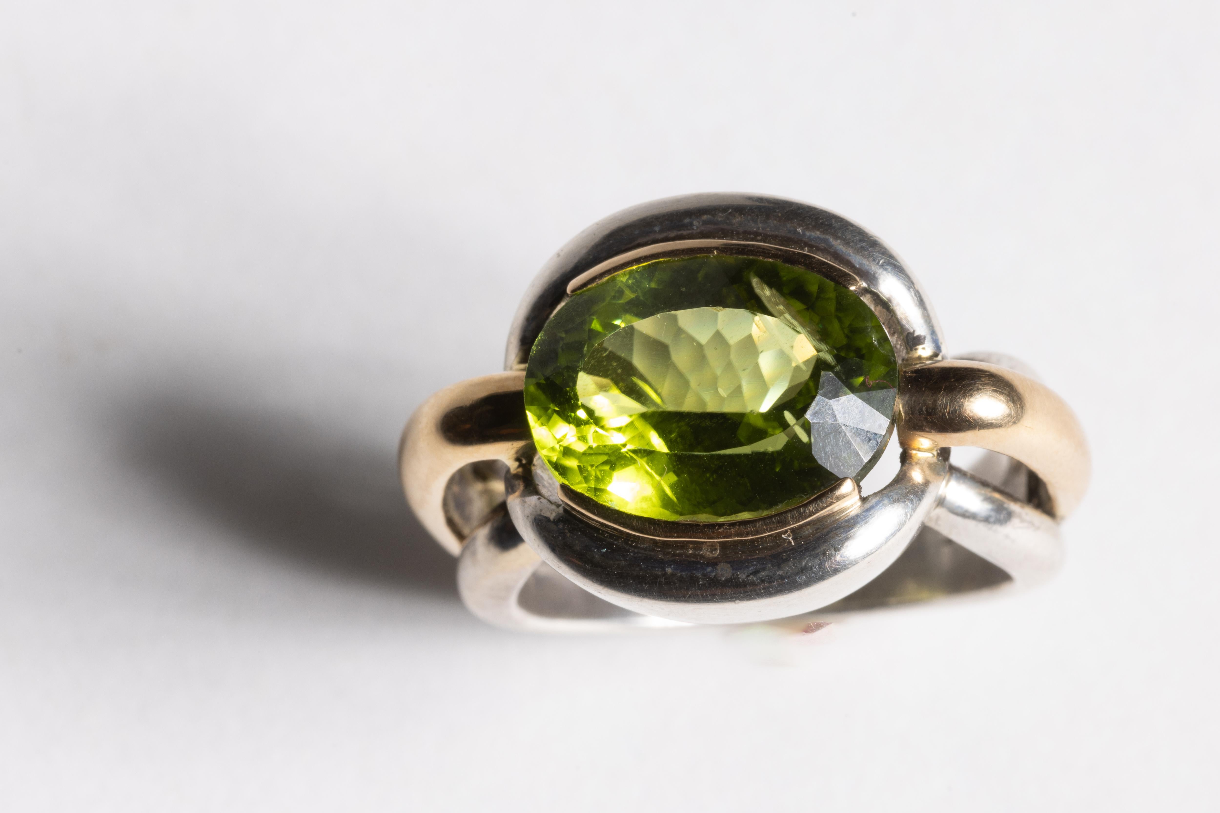 Oval Cut Peridot Ring in 18K Gold and Sterling Silver For Sale