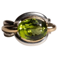Anillo de peridoto en oro de 18 quilates y plata de ley