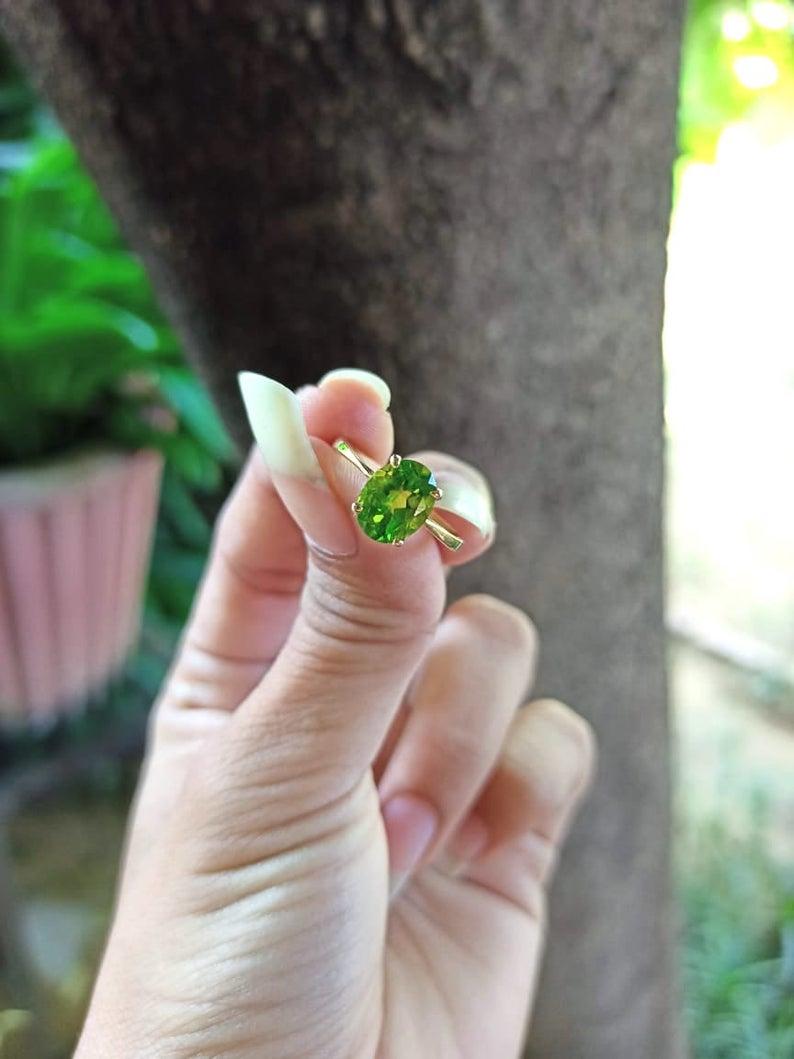 Handmade item
Materials: Gold, Rose gold, Silver, White gold
Gemstone: Peridot
Gem color: Green
Band Color: Gold
Style: Minimalist

You'll Fall in Love with the Stunning Apple Green Color of this Gold Peridot Ring. This is a Perfectly Sized Oval to