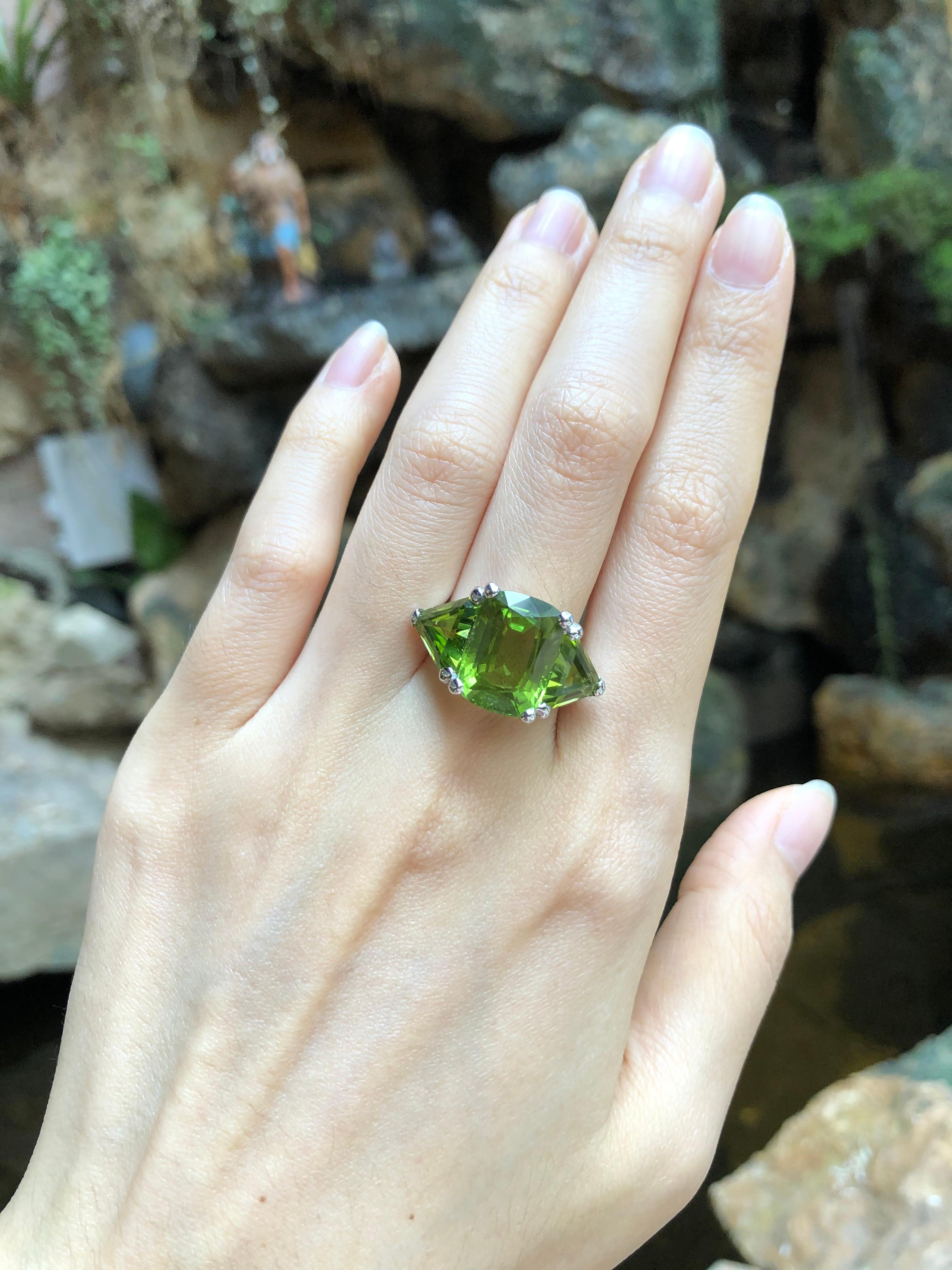 Peridot 9.21 carats with Peridot 6.32 carats Ring set in 18 Karat White Gold Settings

Width:  2.5 cm 
Length: 1.4 cm
Ring Size: 54
Total Weight: 11.98 grams

