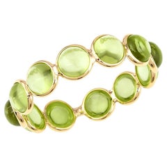 Bracelet en or jaune avec cabochon rond en péridot