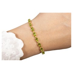 Peridot Tennis Bracelet 8.6 Carats Oval Cut 14K Yellow Gold Plated Silver