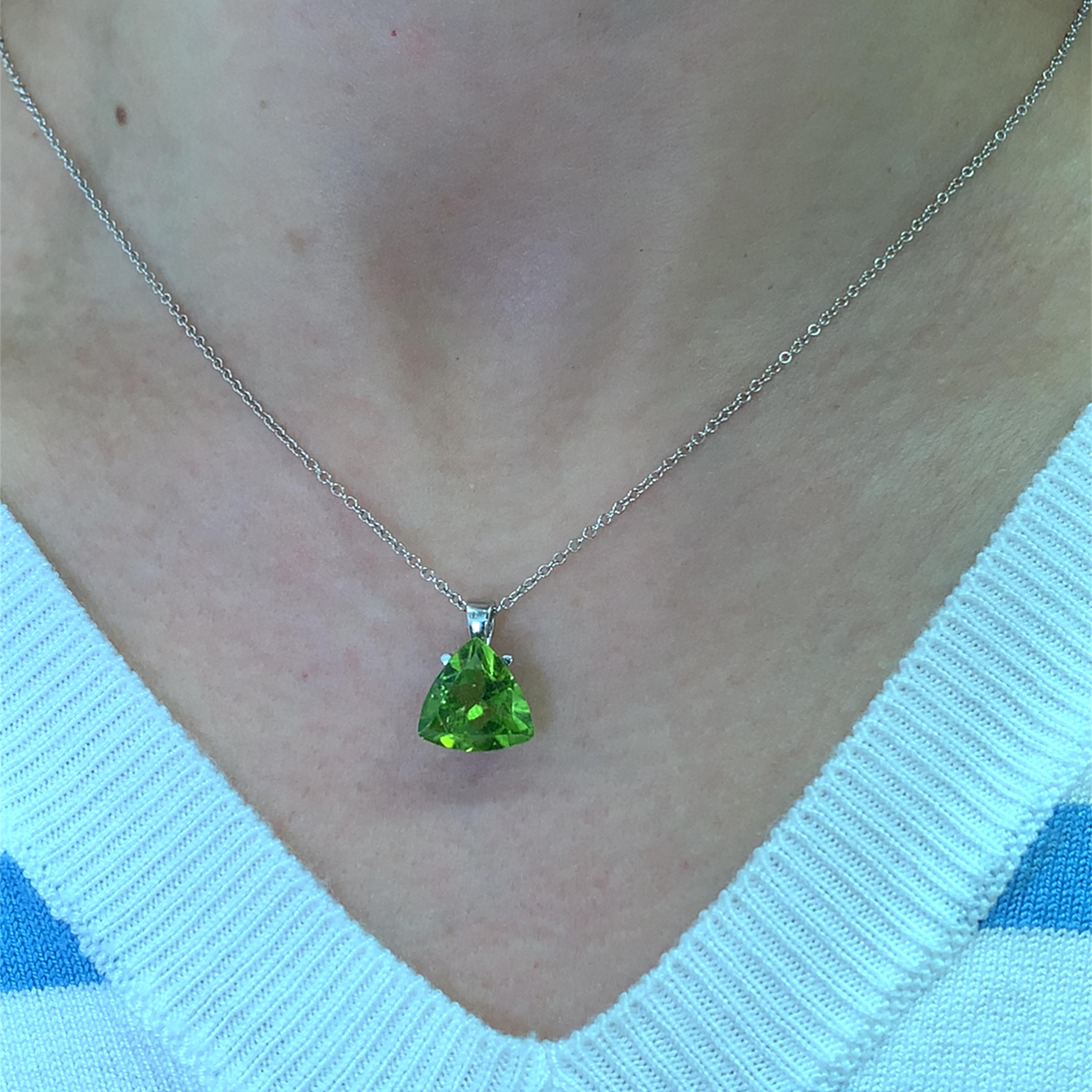 This stunning green peridot gemstone 4.10ct pendant captures the essence of elegance and sophistication. Crafted with precision, the vibrant green hue of the peridot measuring approximately 12mm gemstone is sure to catch the eye, making it a perfect