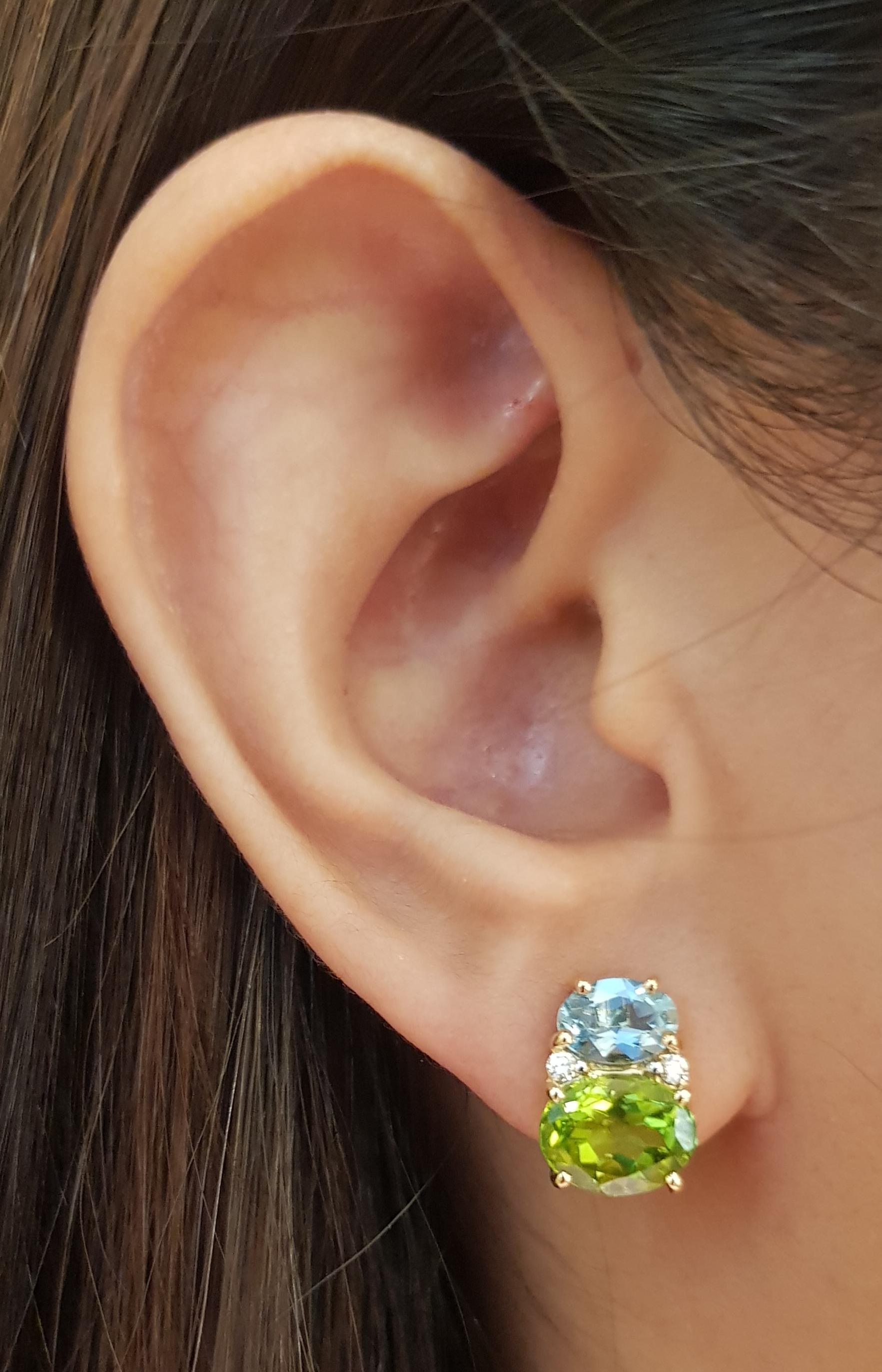 Peridot 4,64 Karat mit  Aquamarin 1,17 Karat und Diamant 0,08 Karat Ohrringe in 18 Karat Goldfassung

Breite:   0.90 cm 
Länge:  1.30 cm
Gesamtgewicht: 5,97 Gramm

