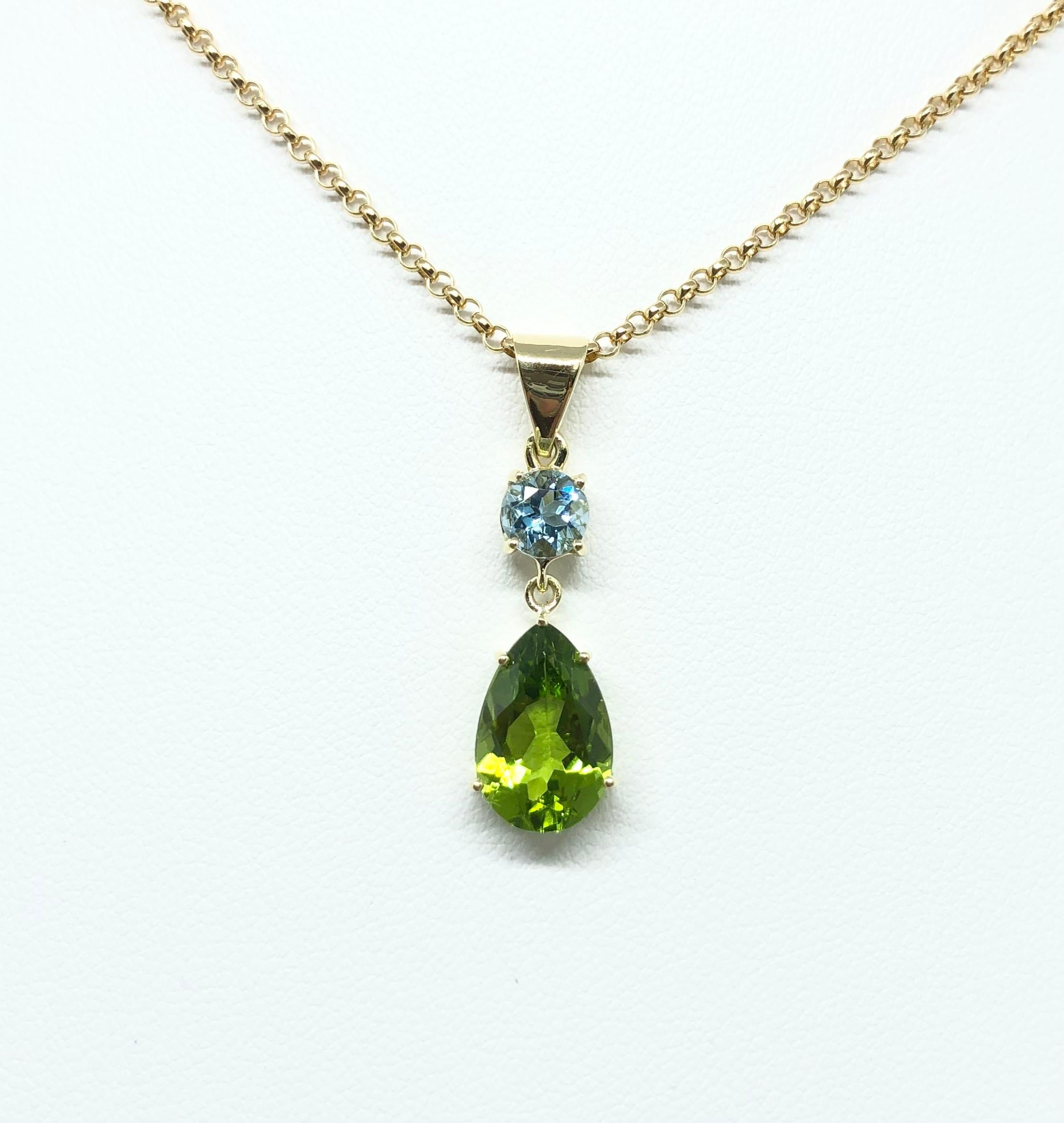 Peridot 1.68 carats with Aquamarine 0.50 carat Pendant set in 18 Karat Gold Settings
(chain not included)

Width: 0.9 cm 
Length: 2.9  cm
Total Weight: 2.11 grams

