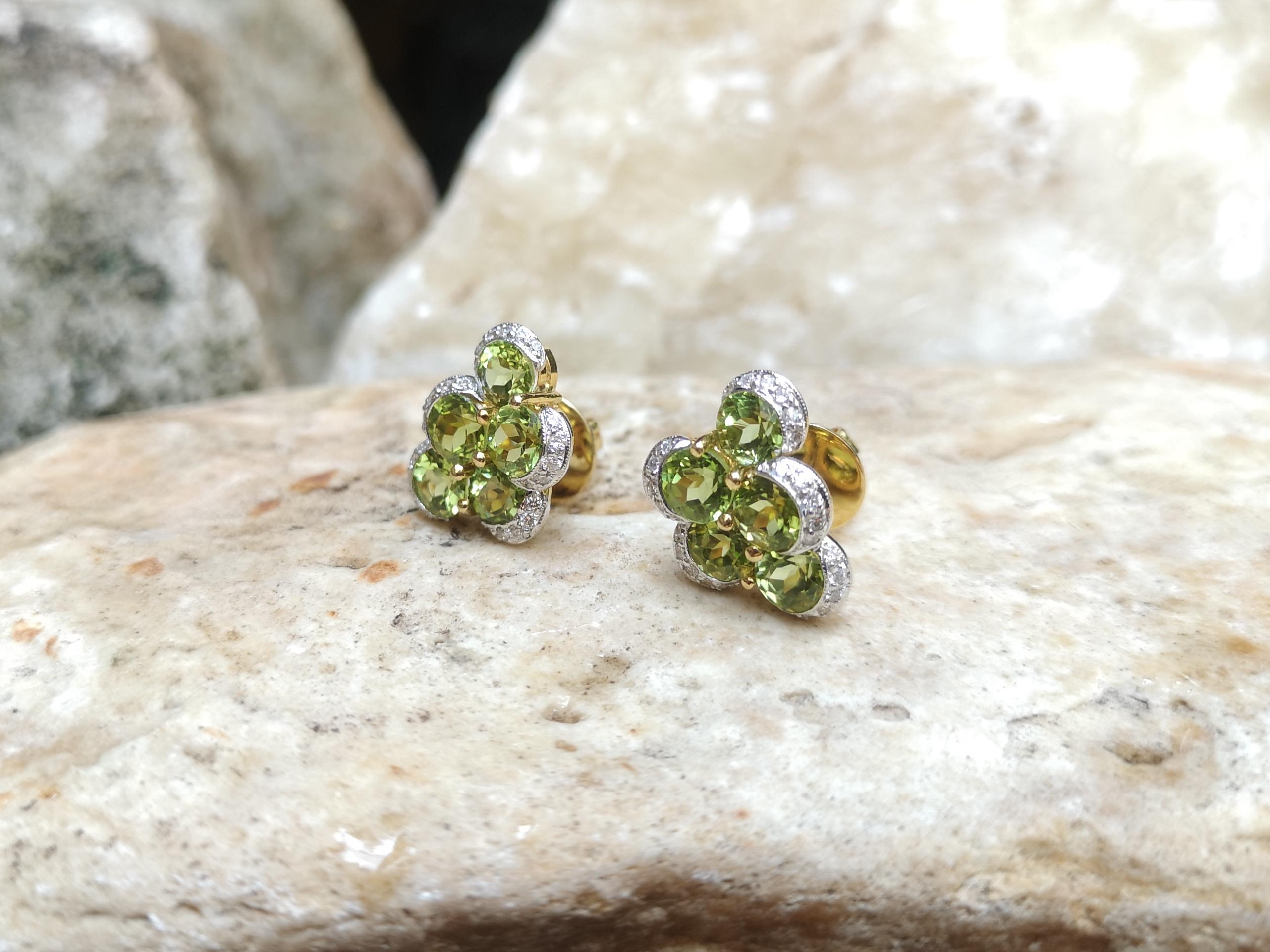 Women's Peridot with Diamond Earrings Set in 18 Karat Gold Settings For Sale