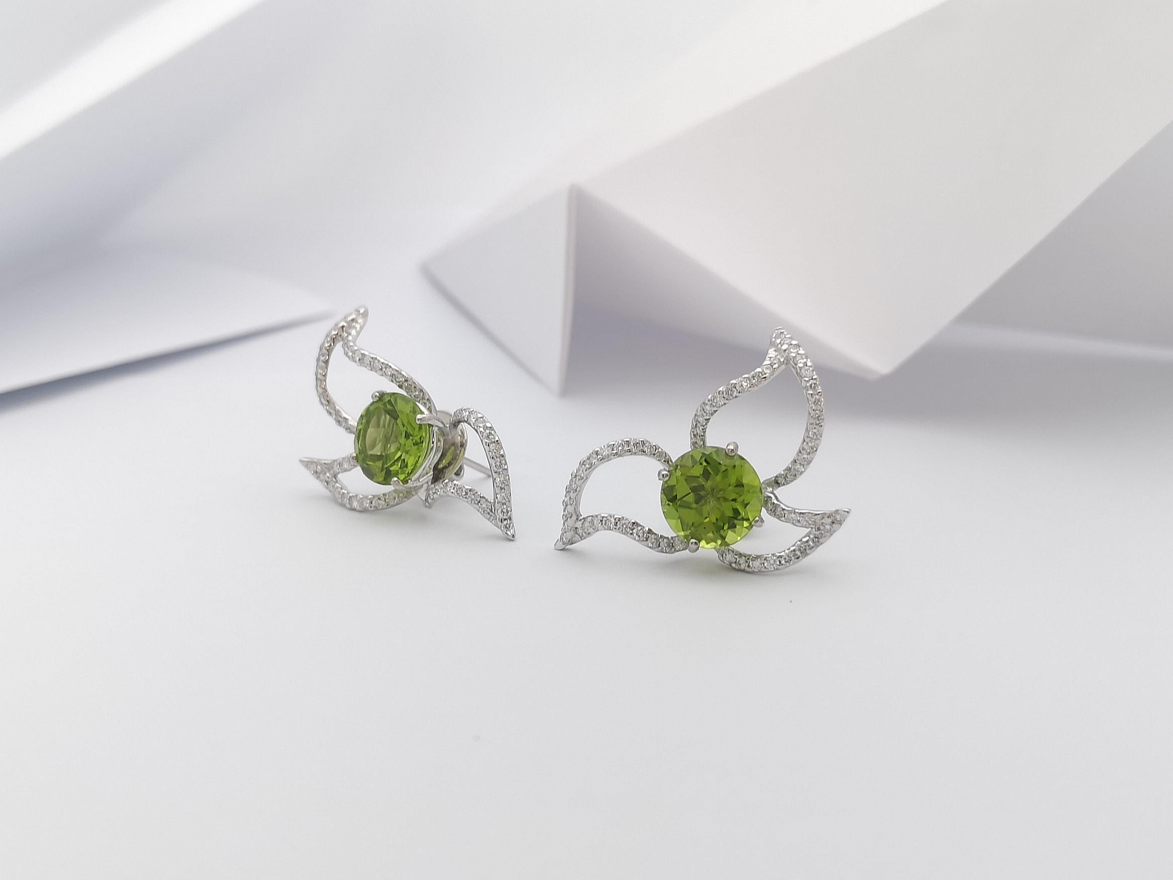 Women's Peridot with Diamond Earrings Set in 18 Karat White Gold Settings For Sale