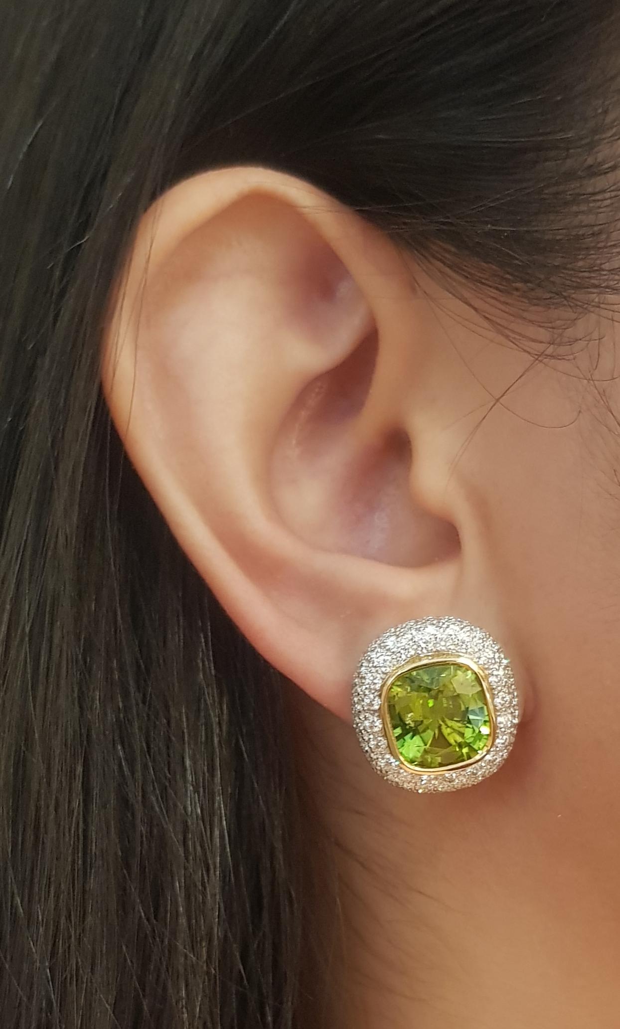 Peridot 10.73 carats with Diamond 2.89 carats Earrings set in 18K Gold Settings

Width: 1.7 cm 
Length: 1.7 cm
Total Weight: 16.41 grams

