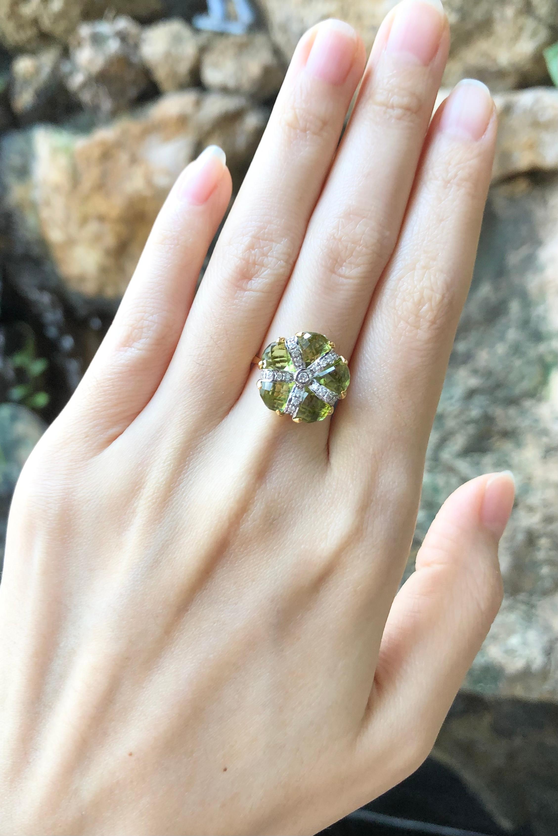 Contemporary Peridot with Diamond Ring Set in 14 Karat Gold Settings For Sale