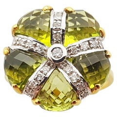 Peridot with Diamond Ring Set in 14 Karat Gold Settings