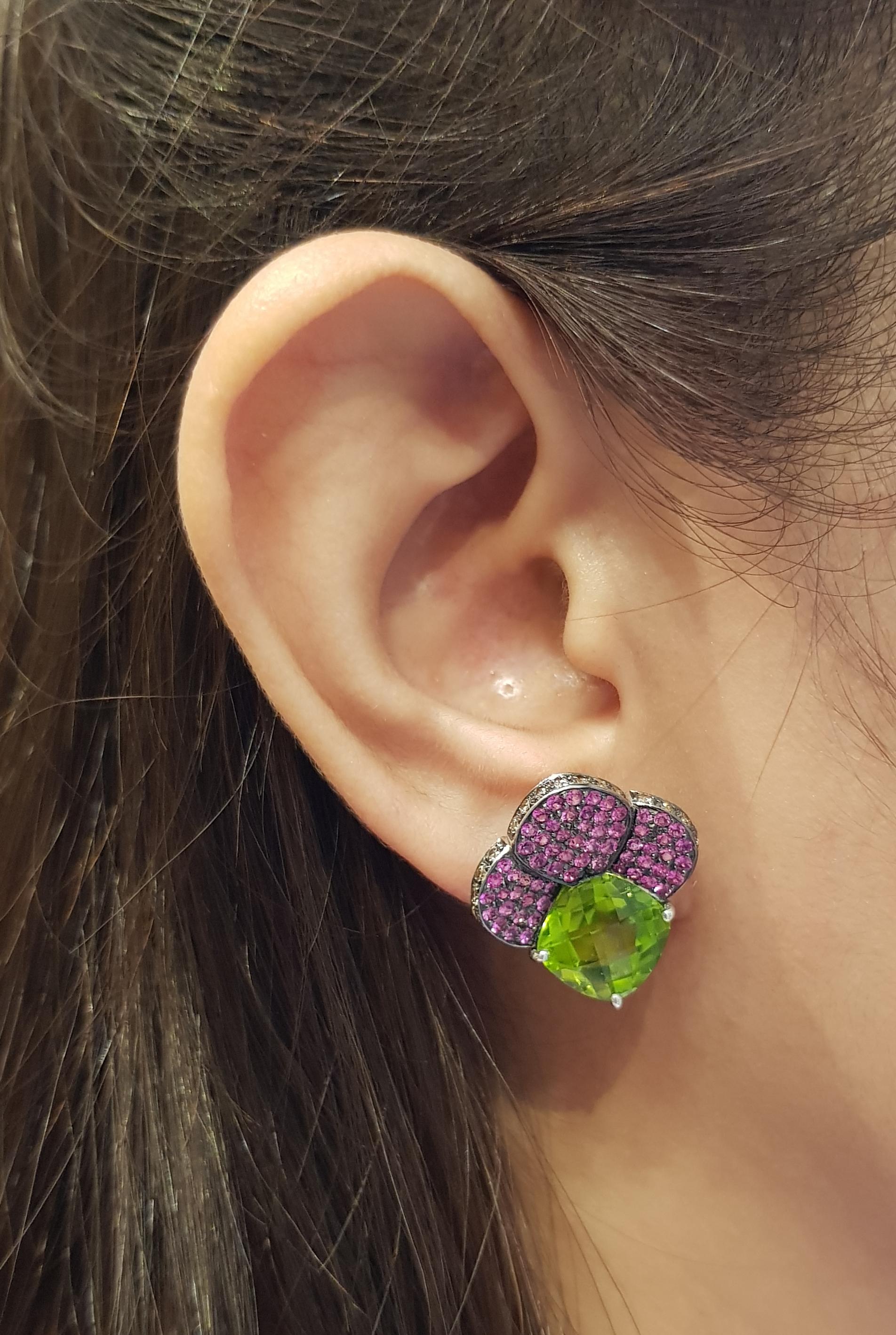 Peridot 9.90 carats with Pink Sapphire 1.51 carats and Brown Diamond 0.63 carat Earrings set in 18 Karat White Gold Settings

Width:  2.0 cm 
Length: 2.1 cm
Total Weight: 10.82 grams

