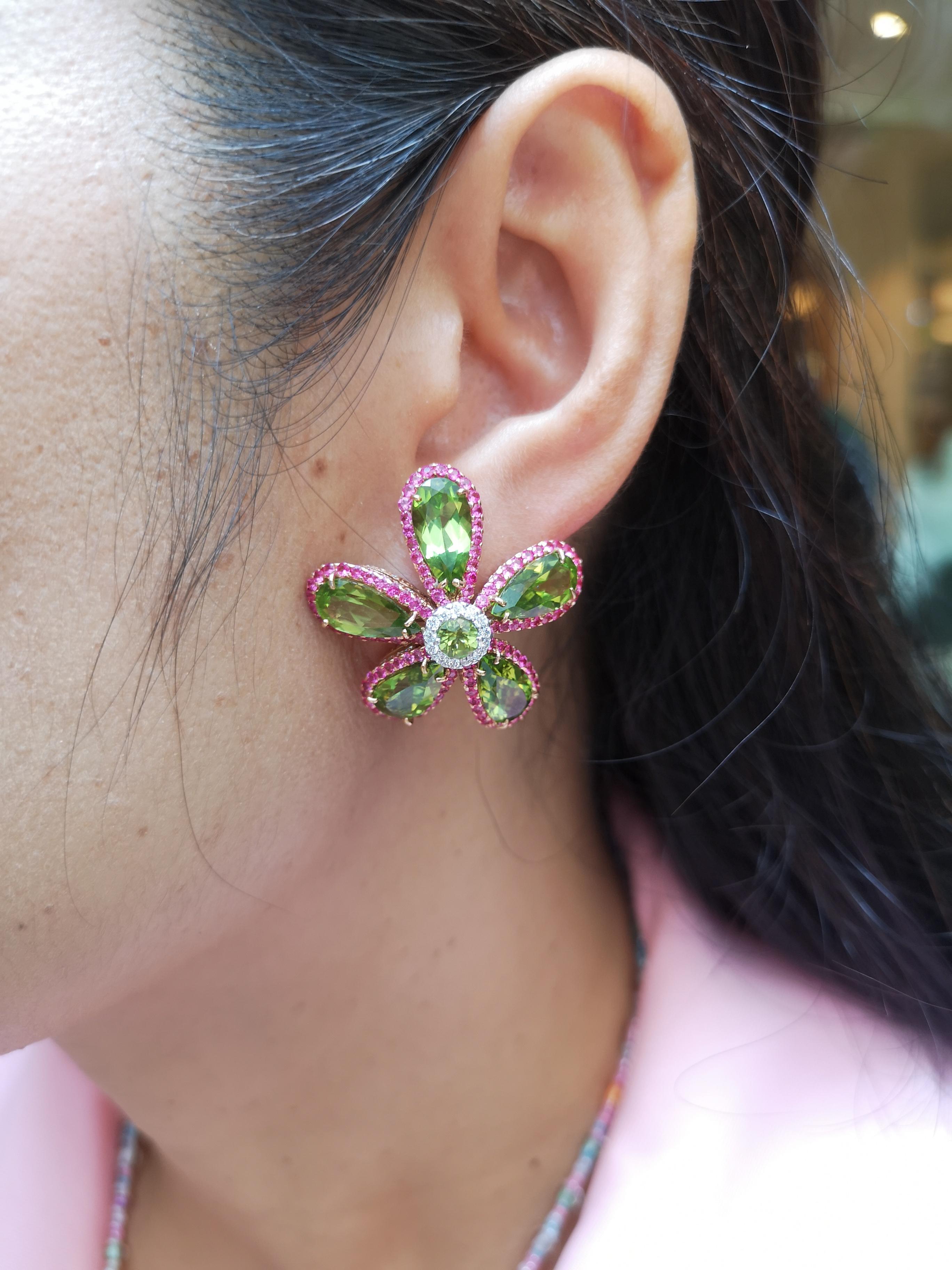 Peridot 20.52 carats with Pink Sapphire 3.0 carats and Diamond 2.58 carats Earrings set in 18 Karat White Gold Settings

Width: 3.0 cm
Length: 3.0 cm 

