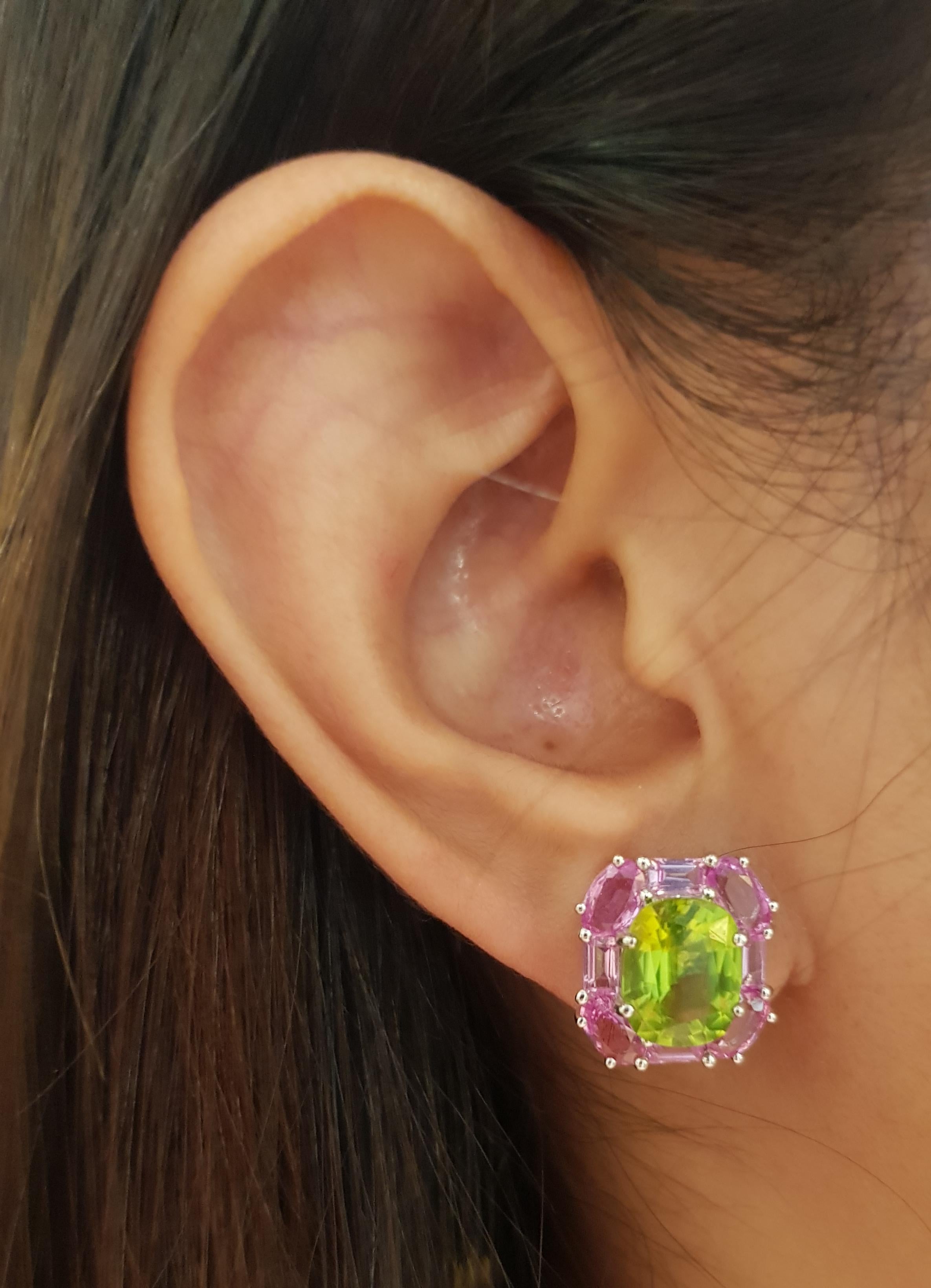 Peridot 5.76 carats with Pink Sapphire 5.62 carats Earrings set in 18 Karat White Gold Settings

Width:  1.4 cm 
Length: 1.5 cm
Total Weight: 10.26 grams



