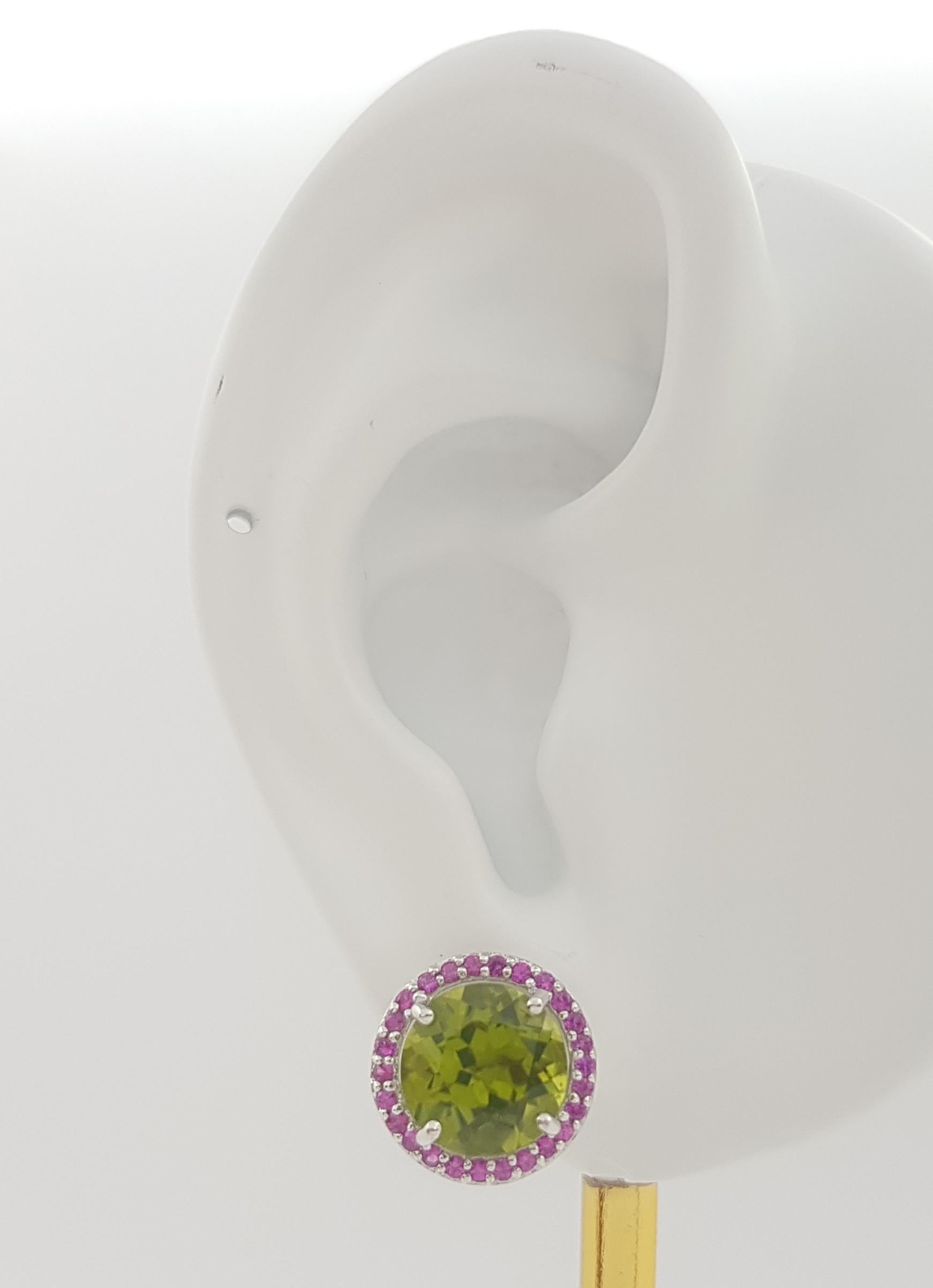 Peridot 5.93 carats with Pink Sapphire 0.43 carat Earrings set in 18K White Gold Settings

Width: 1.2 cm 
Length: 1.2 cm
Total Weight: 5.22 grams

