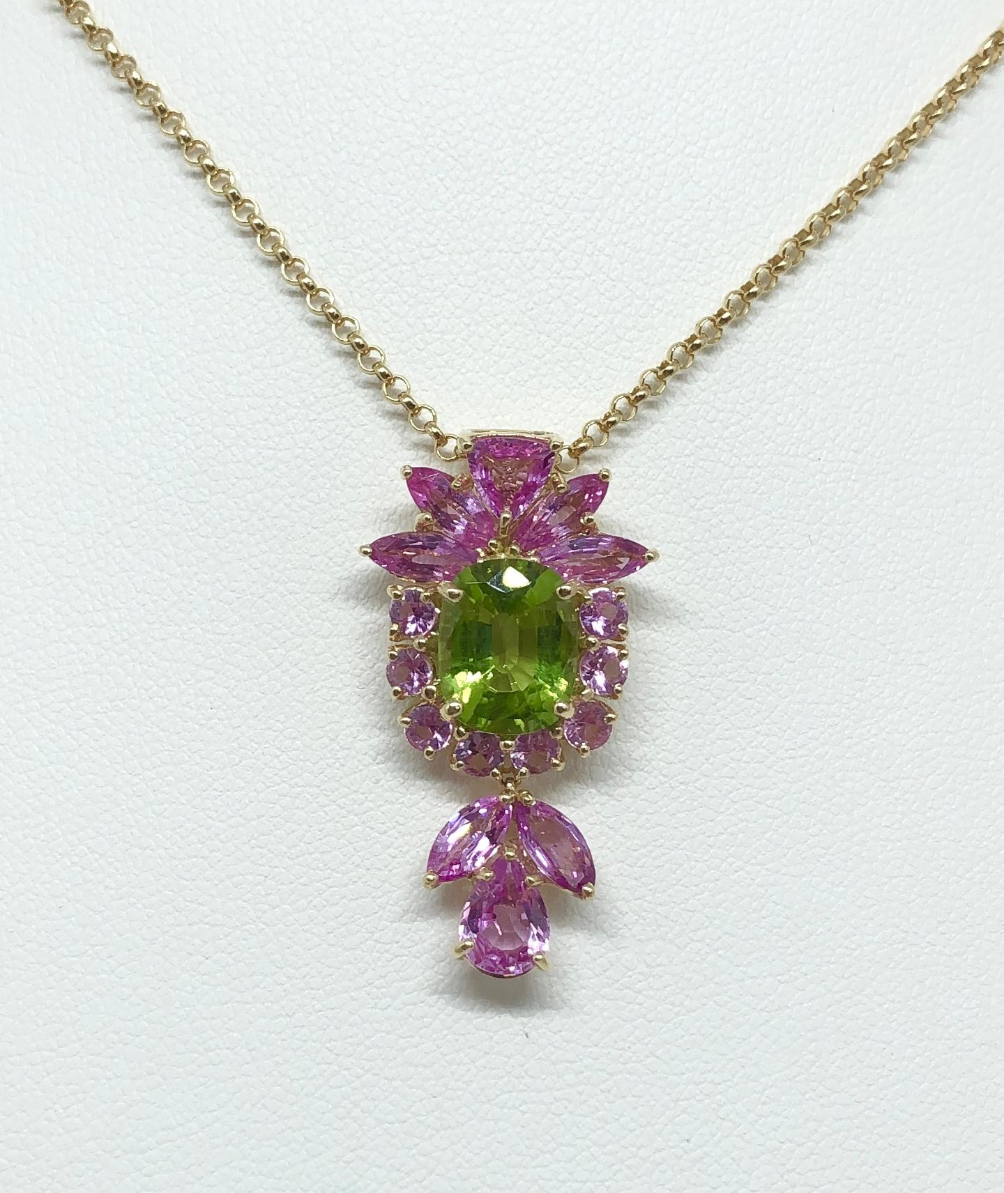 Peridot 3.0 carats with Pink Sapphire 4.41 carat Pendant set in 18 Karat Gold Settings
(chain not included)

Width: 1.8 cm 
Length: 3.3 cm
Total Weight: 5.12 grams

