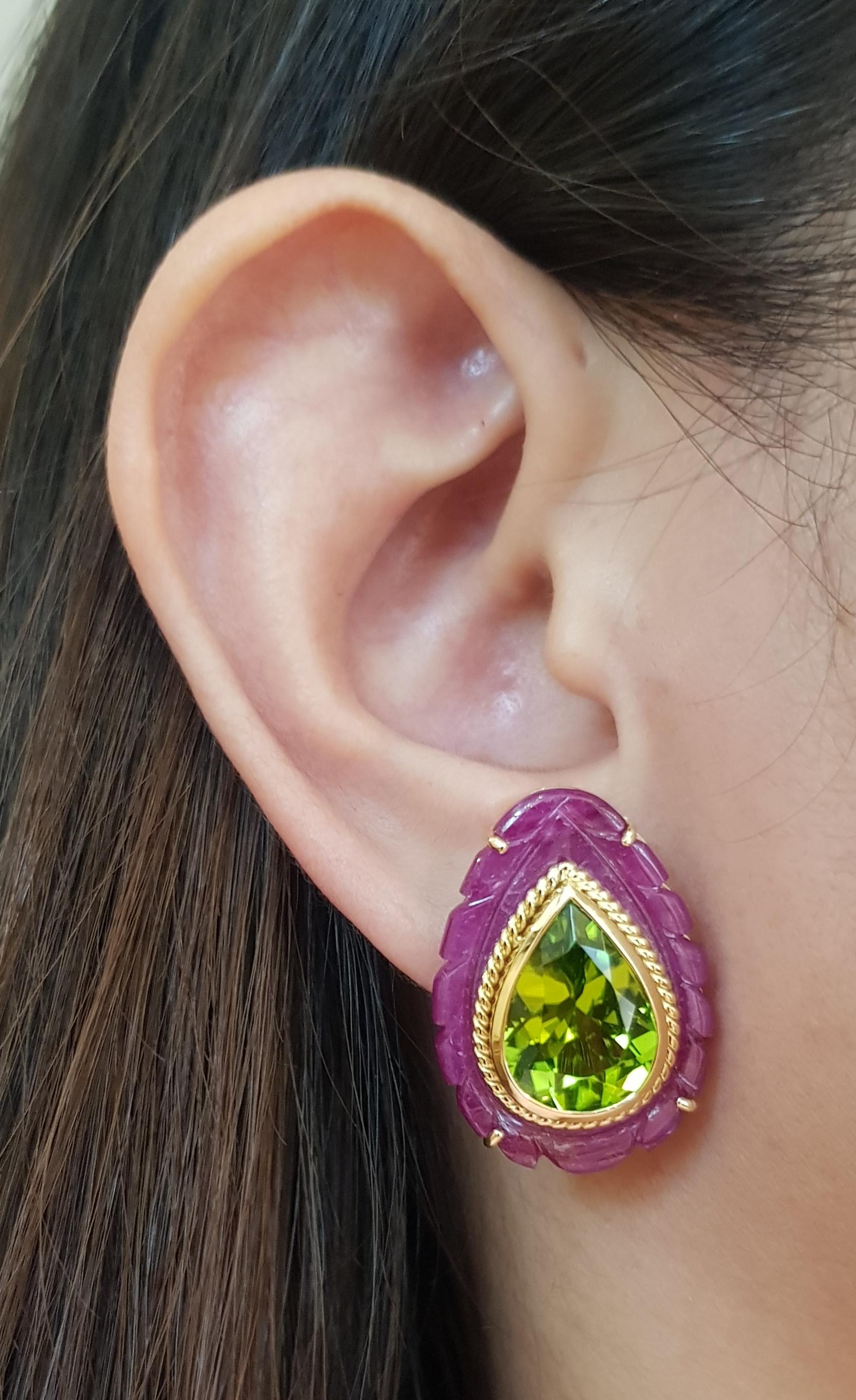 Peridot 11.51 carats with Ruby 25.34 carats Earrings set in 18 Karat Gold Settings

Width:   2.0 cm 
Length:  2.8 cm
Total Weight: 19.9 grams


