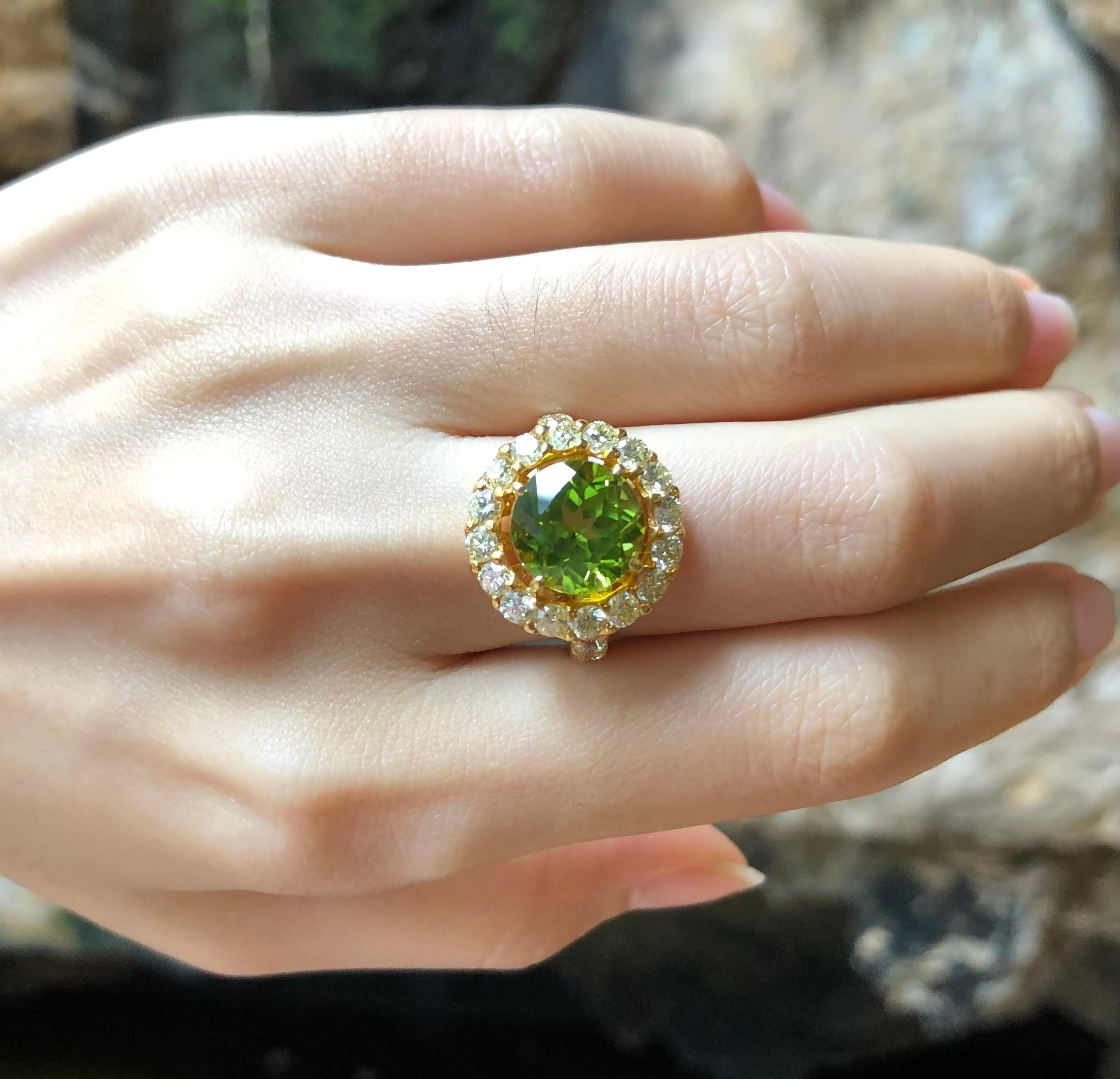 Peridot 4.21 carats with Yellow Diamond 2.20 carats Ring set in 18 Karat Gold Settings

Width:  1.7 cm 
Length:  1.7 cm
Ring Size: 52
Total Weight: 6.52 grams

Peridot 
Width:  1.0 cm 
Length:  1.0 cm
