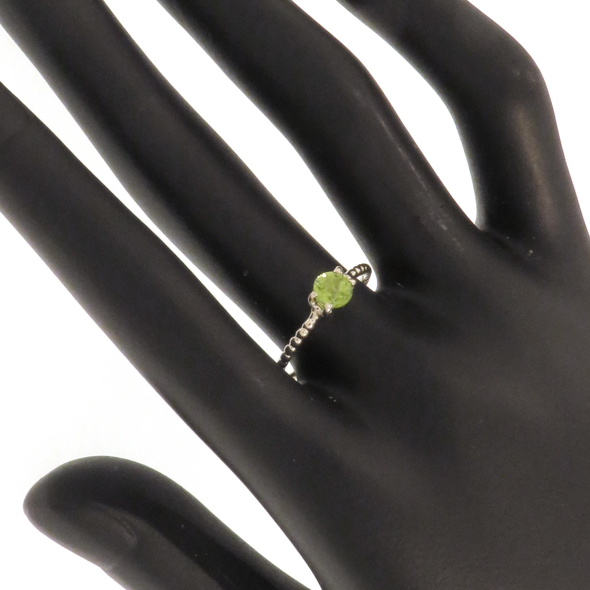 Stacking ring handmade in 9 carat white gold with brilliant cut peridot 6 mm / 0.039 inches. Finger size: US size 7, Italian size 14, UK size O, French size 54. The ring can be re-sized to the customer's size before shipping. 
Total weight: 1.4