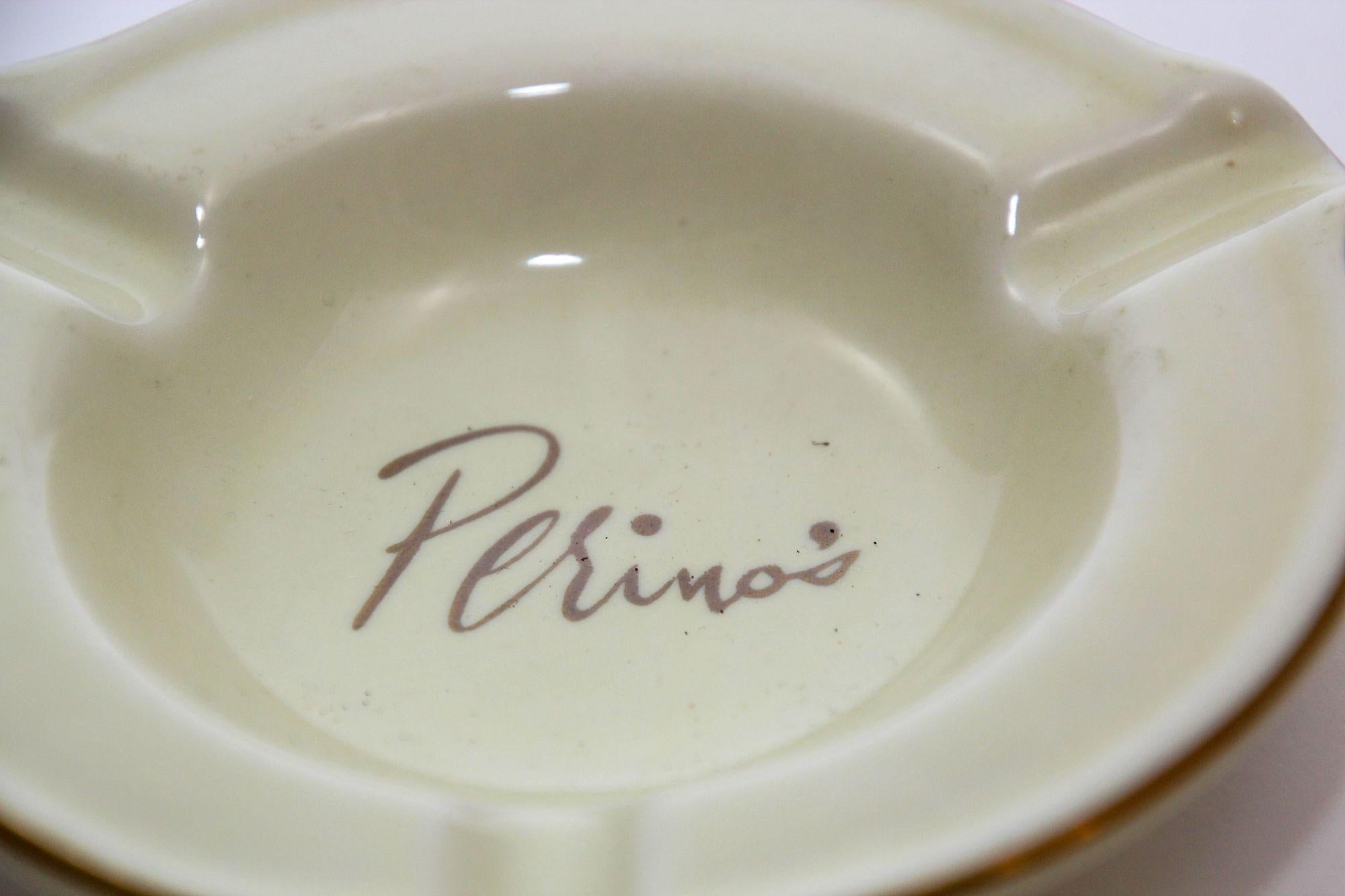 Vintage porcelain ashtray from the long gone Perino's Restaurant in Los Angeles, CA.
Cream colored porcelain dish ashtray with gold edge and Perino's in gold script.
Has three 