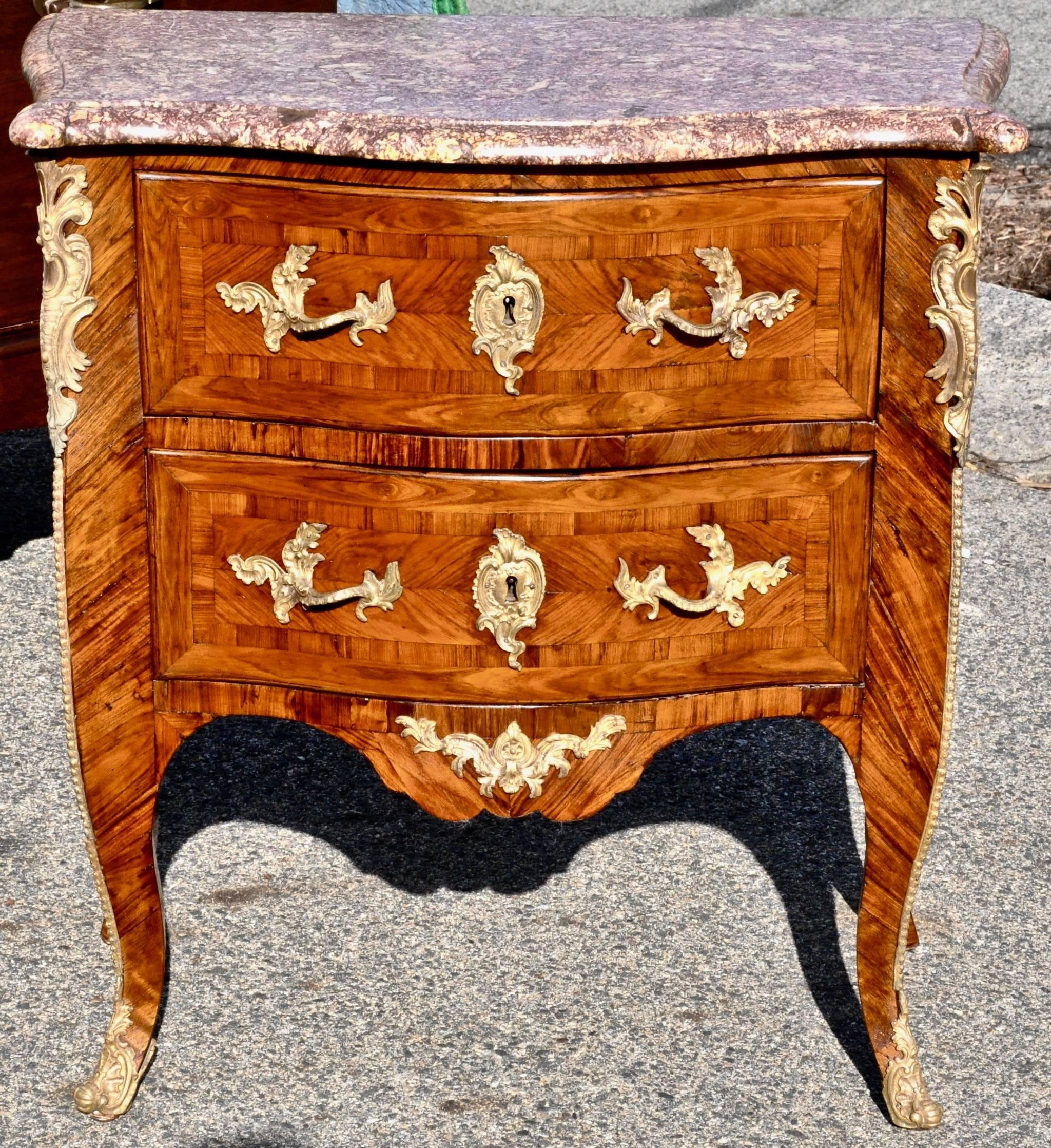 Period Kingwood marble-top commode by Saunier.

- Great Kingwood parquetry
- Original mounts
- Original pyrenees gris marble
- Two-drawer.


Cabinetmaker:
Jean-Charles Saunier became a master on August 27, 1743. He comes from a famous and