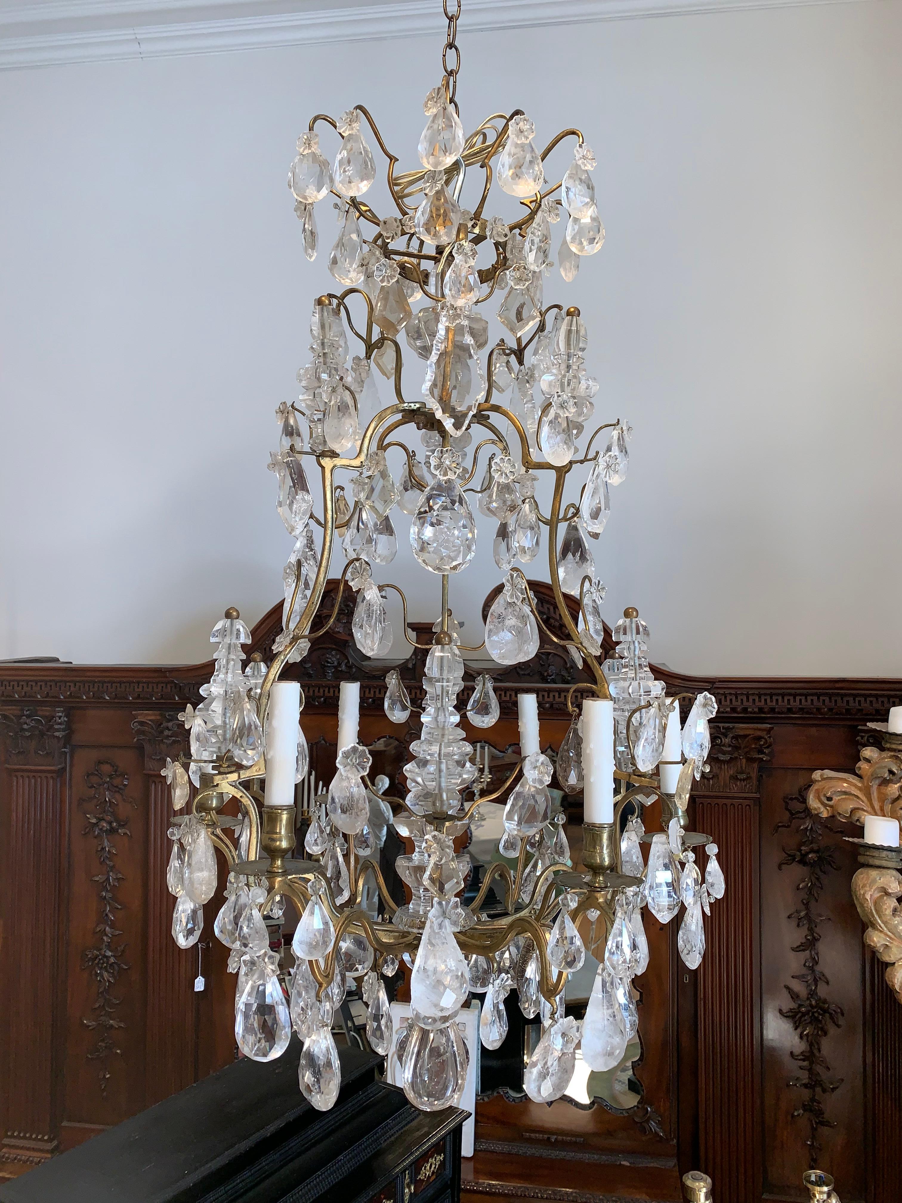 Period rock crystal chandelier of the mid-18th century.

With cage form and ALL prisms being French high clarity rock crystal--mostly original to the piece. All elements including towers
or spires in rock crystal as well. French wired recently