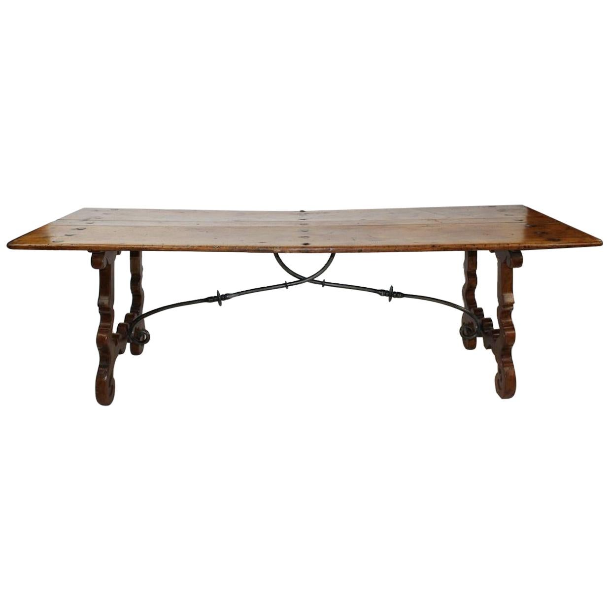 18th century continental refectory table with beautiful original wood top and iron stretchers.