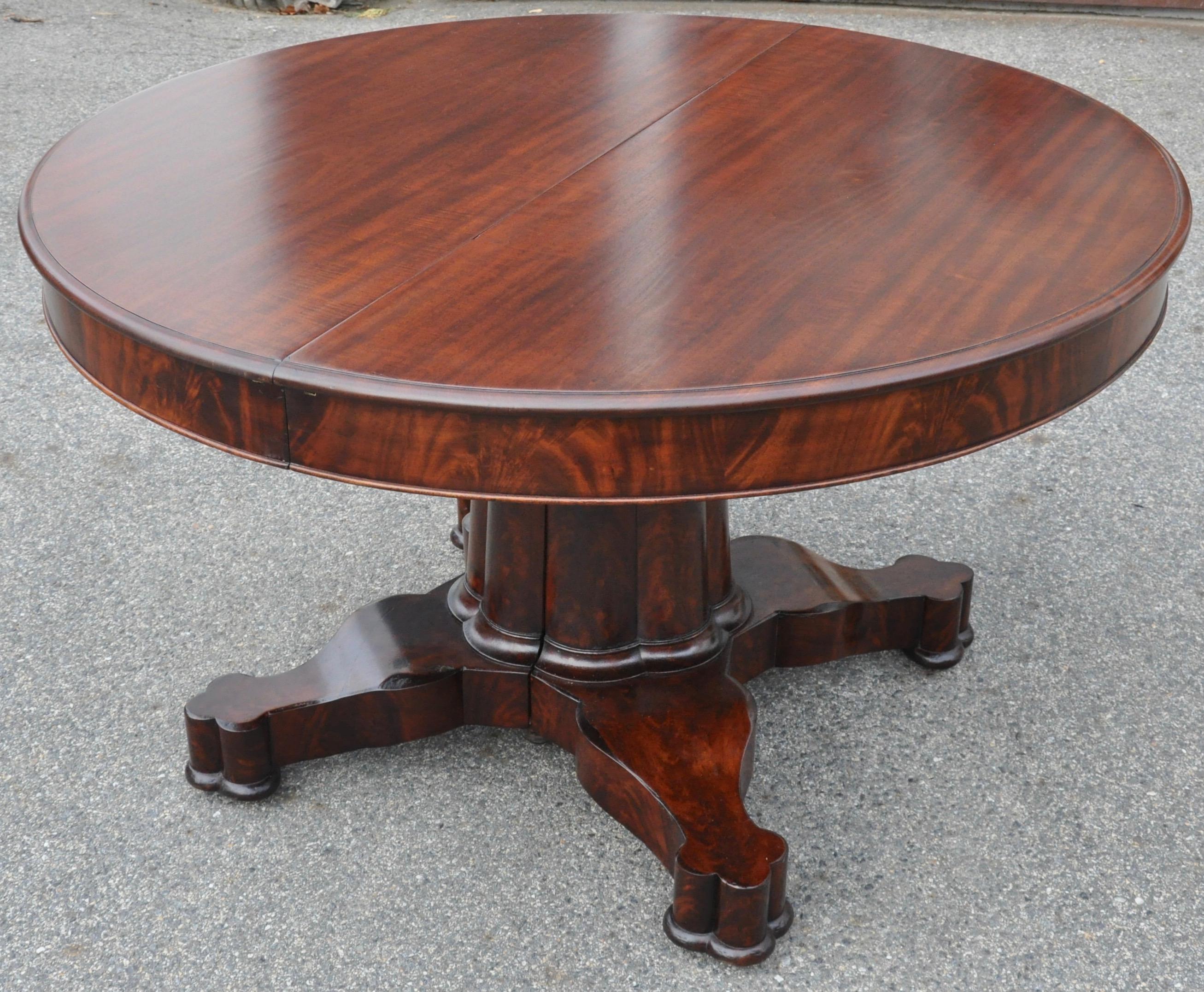 Period New York Classical Empire dining table with four leaves.  Signed by Charles hope, New York

--Crotch Mahogany and solid top boards.
--Composite Gothic column base with splits in extension.
--Four clover ended feet
--Leaves are