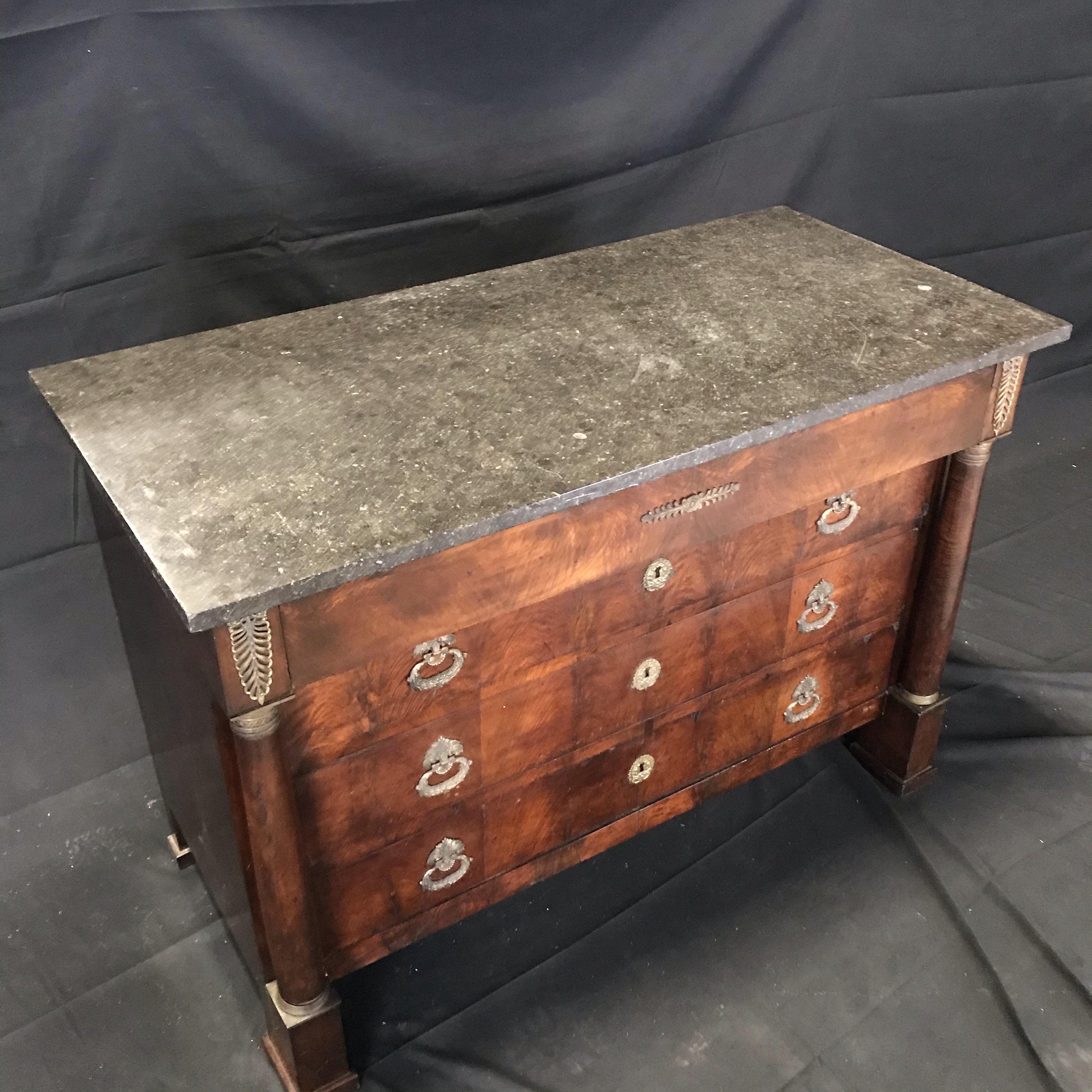 Period antique French Empire rich mahogany chest of drawers with beautiful gray marble top. Beautiful decorative brasses. Early and all original. #4324.


 