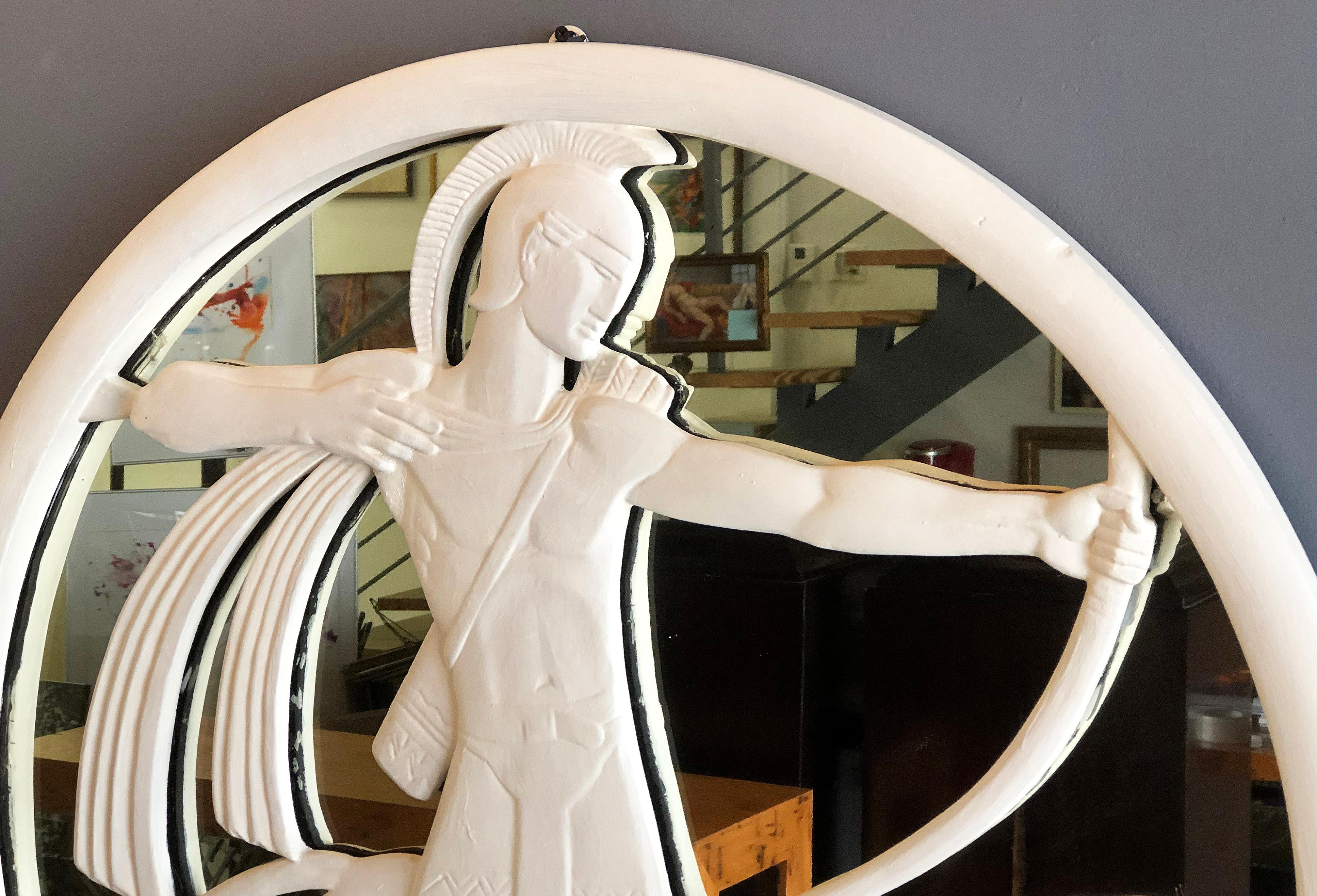 Period Art Deco plaster archer and dog mirror

Offered for sale is a 1940s Mid-Century Modern Art Deco plaster mirror with an iconic archer hunter and dog design. The circular mirror combines functionality with art. This period mirror is a great