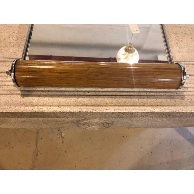 A period Art Deco rosewood and chrome mirror top serving tray possibly by Gustave Serrurier-Bovy. Stamped Made in Belgium. This fine sleek and stylish serving tray is certain to bring a smile to everyone face.
