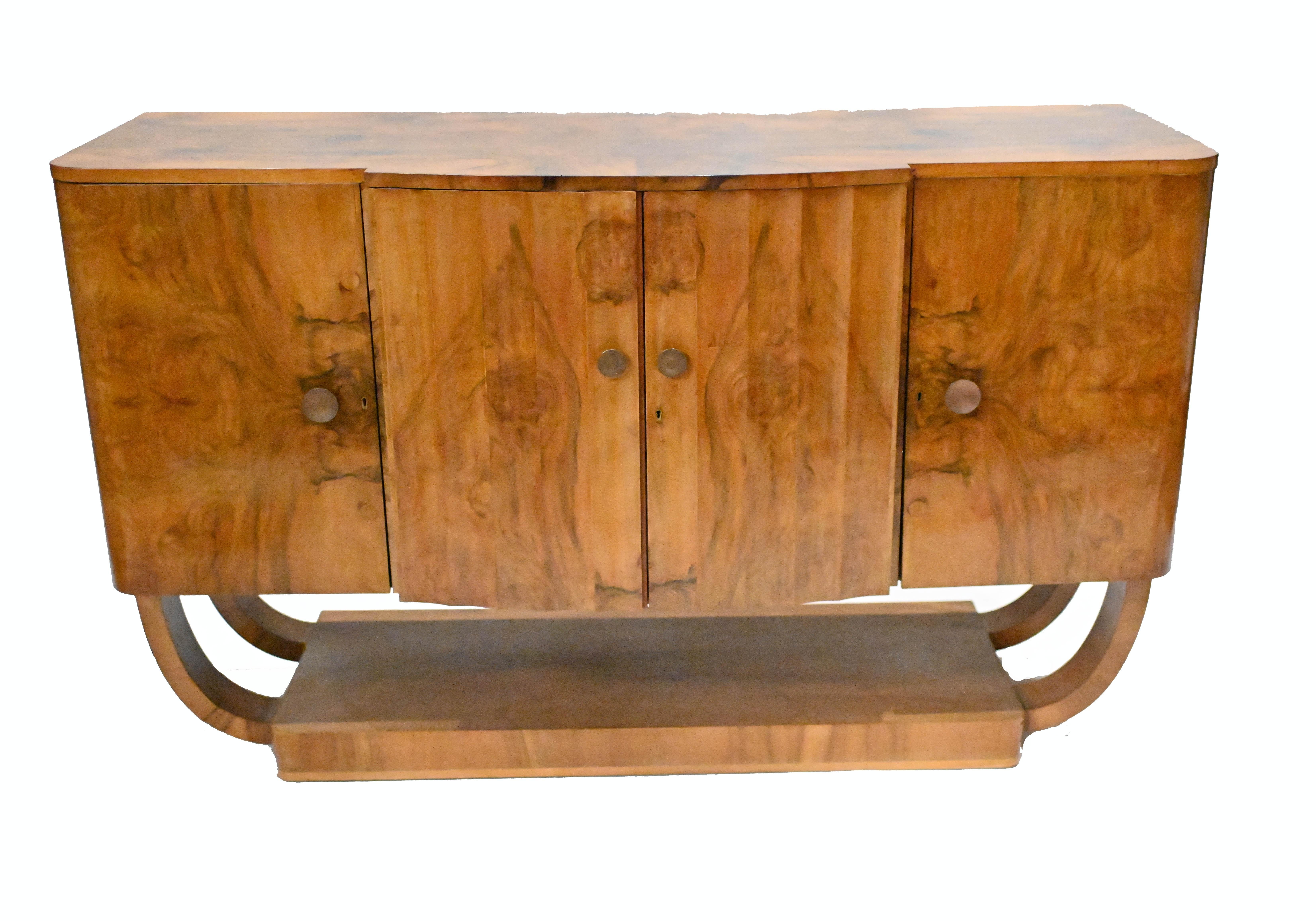 Gorgeous period art deco sideboard or cabinet
Circa 1930 on this piece hand crafted from burr walnut
Features ribbed cupboards in the centre
Clean and minimal design perfect for modern interiors
Great interiors look and we are expecting a lot of