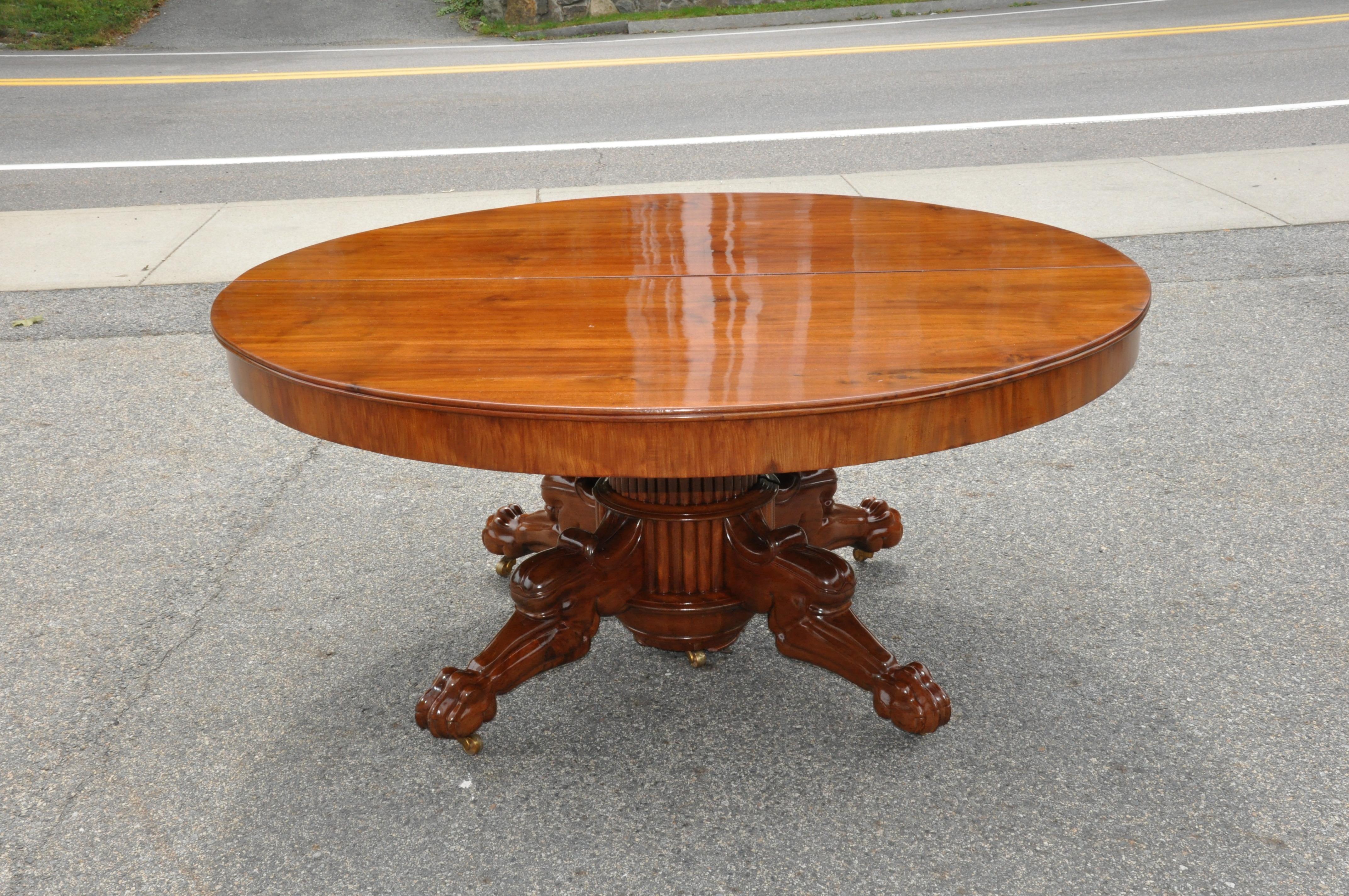 Walnut Baltic or Scandinavian neoclassical dining table

Early 19th century walnut expanding dining table. Round when closed with three additional leaves. Lion leg and paw supports styled from Jacob Desmalter's French designs but wood and