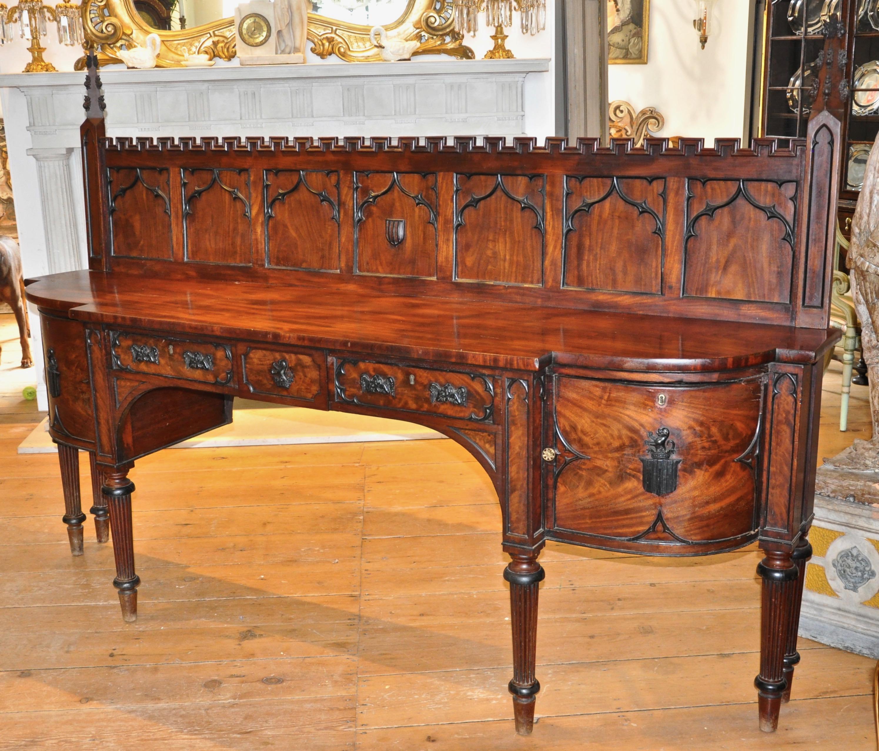 Period Gillows attributed mahogany sideboard of the late Georgian period

--Gothic panel, Anglican faces, armorial, rampant dog in marquess crown
--Original wine drawer
--Incredible cuban mahogany figuring
--Finish shown before