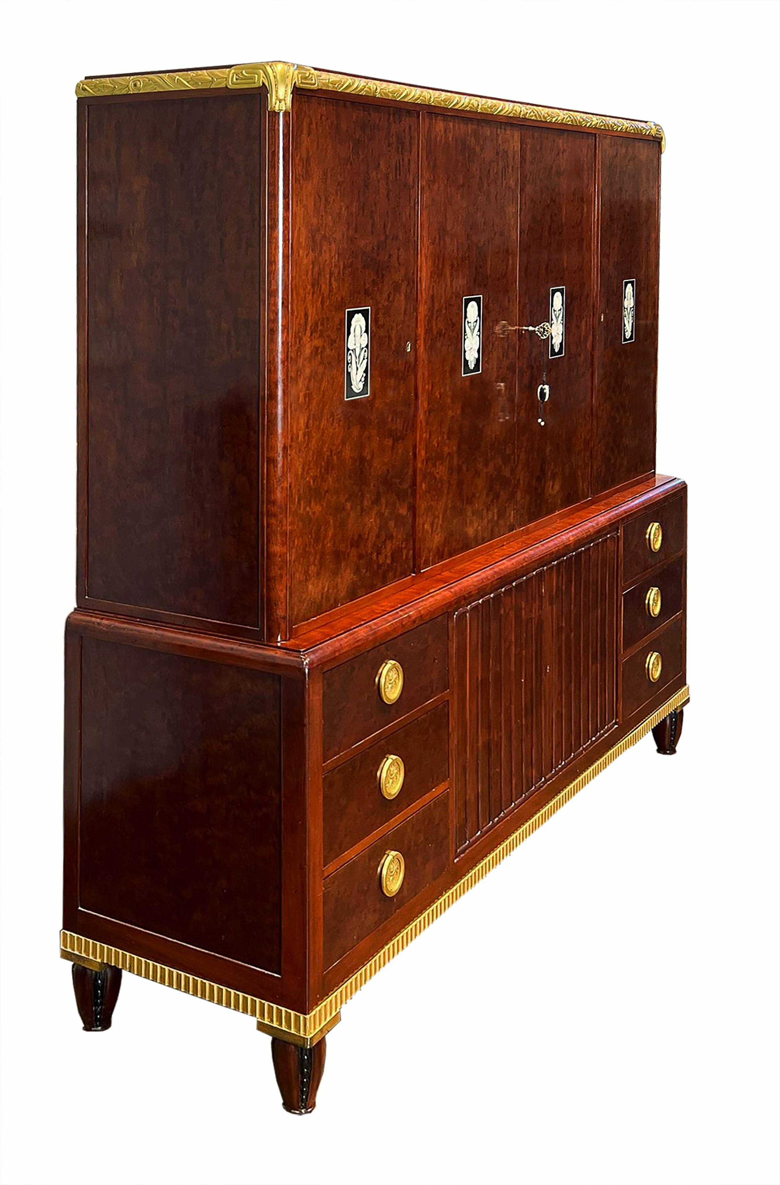 A fine case piece of extraordinary craftsmanship and design of plum pudding mahogany created by one of the most celebrated ébénistes and bronziers of late 19th and early 20th century France. The Haentgés brothers are listed by Denise Ledoux-Lebard