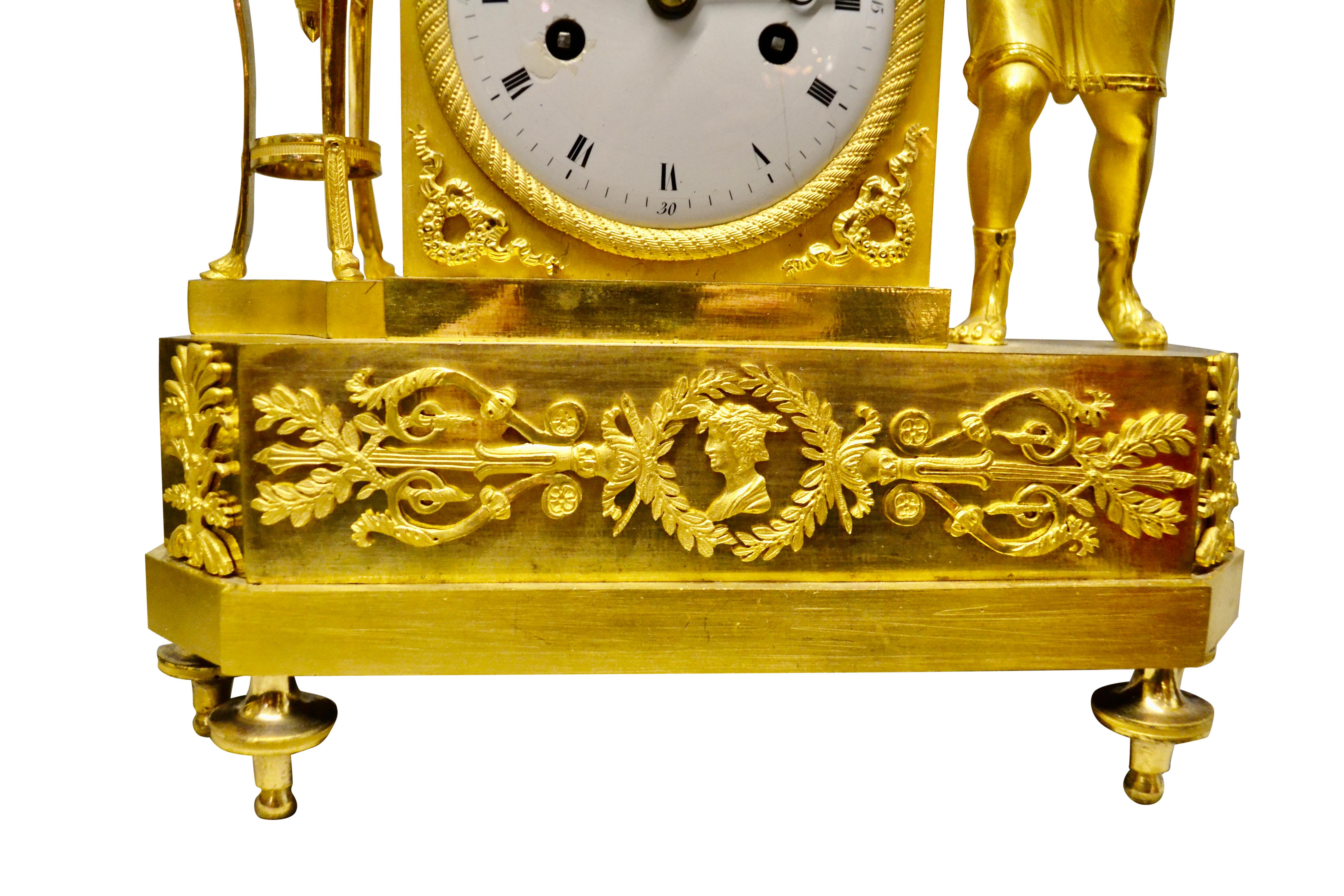 19th Century Period French Empire Mantle Clock Depicting a Winged Cupid Playing a Lute For Sale