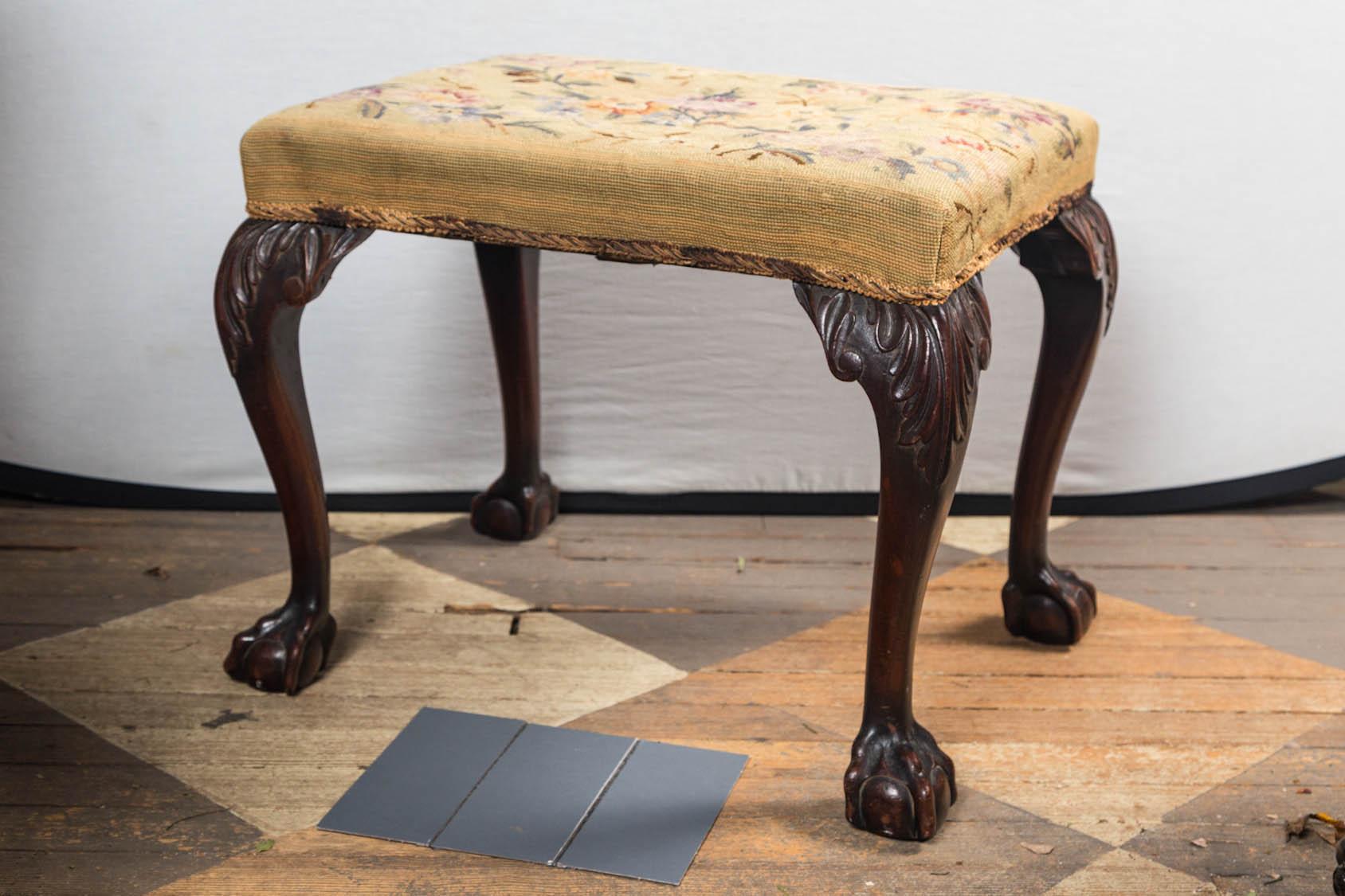 Mahogany stool with cabriole legs ending in ball and claw feet. Acanthus leaf carved knees.
 