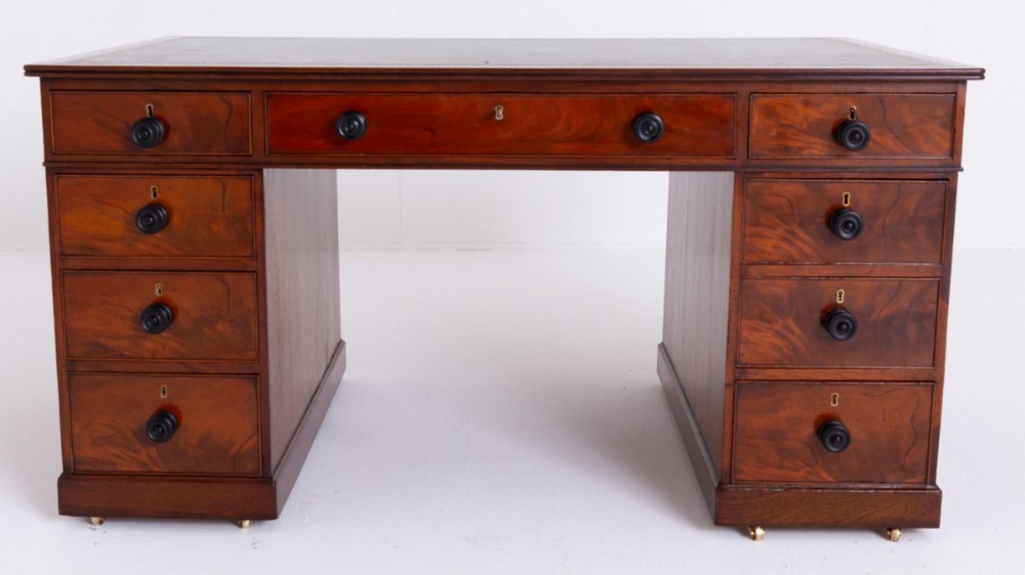 Georgian mahogany partners desk.
This quality desk features 9 oak lined drawers.
Period Georgian antique
The drawers having ebonised turned knobs and wonderful flame mahogany timbers.
The reverse of the desk having 3 working drawers and 2