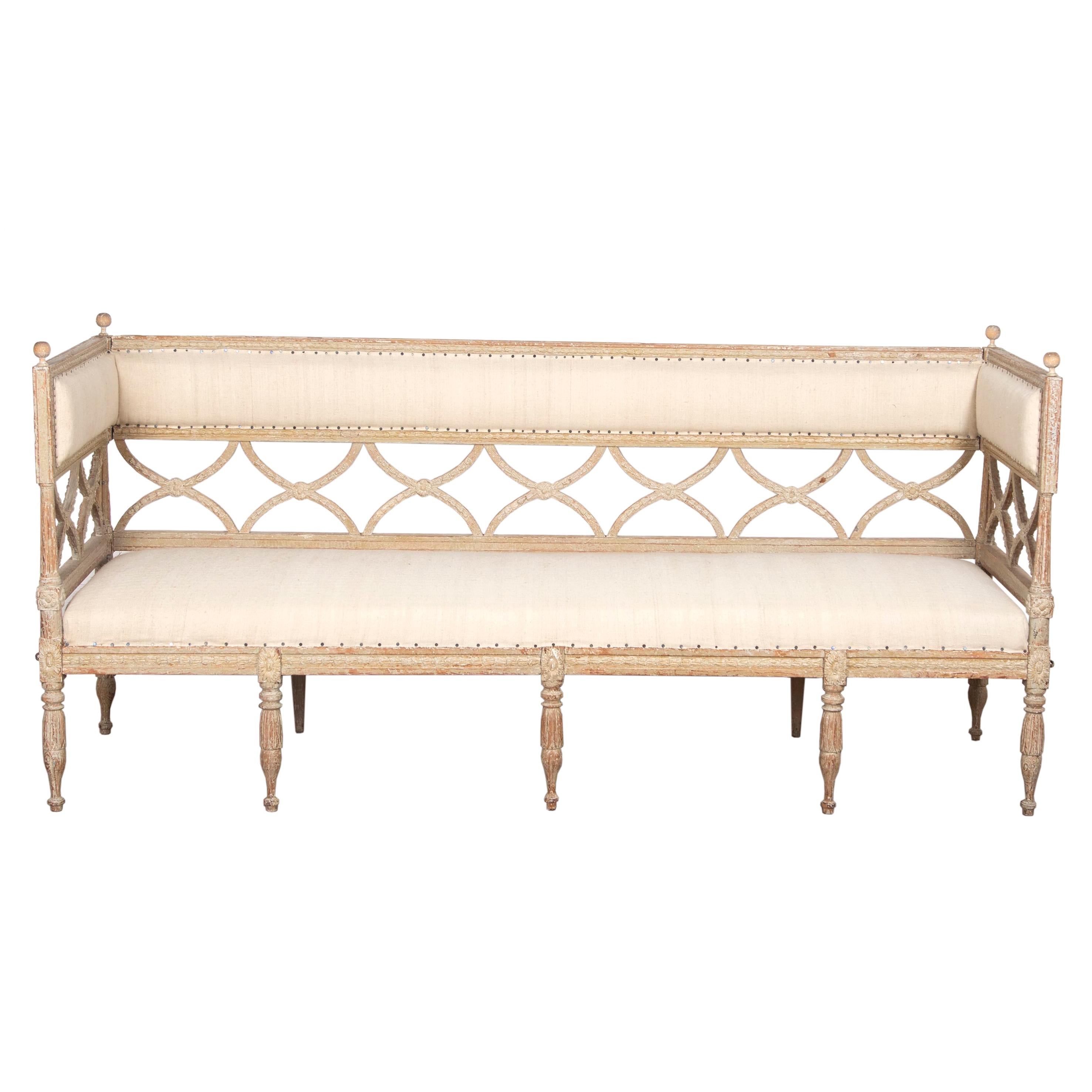 19th century Gustavian sofa scraped to original paint.
This model is referred to as a “Bellman Sofa “ in Sweden. It features the typically curved crosses in the back which gives its name after the famous Swedish poet.
This sofa is extra special