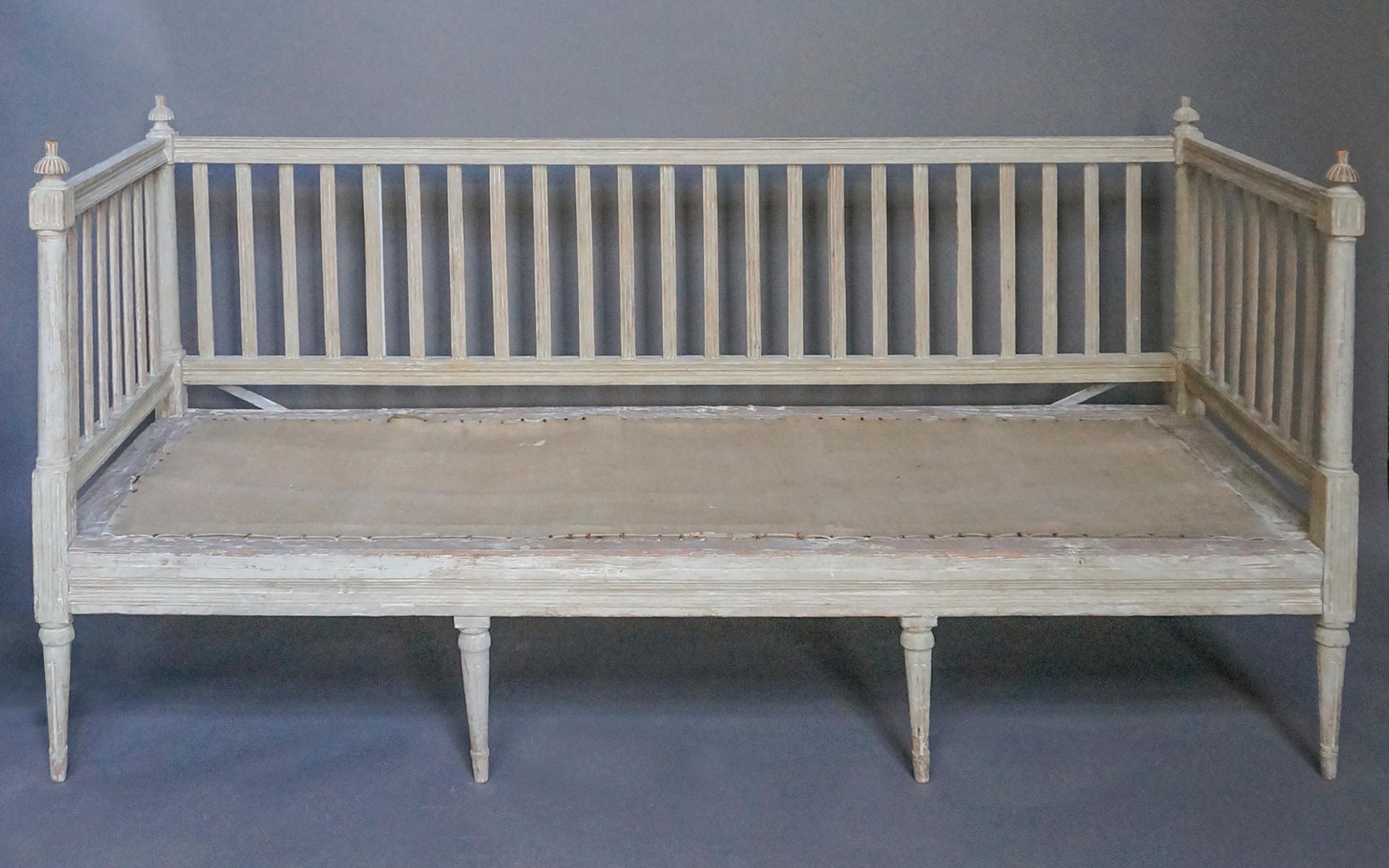 Gustavian sofa, Sweden circa 1790, in original paint. Baluster back and sides with turned finials and reeded corner blocks. Molded rails and turned legs, and original painted surface. Includes new tufted cushion.
