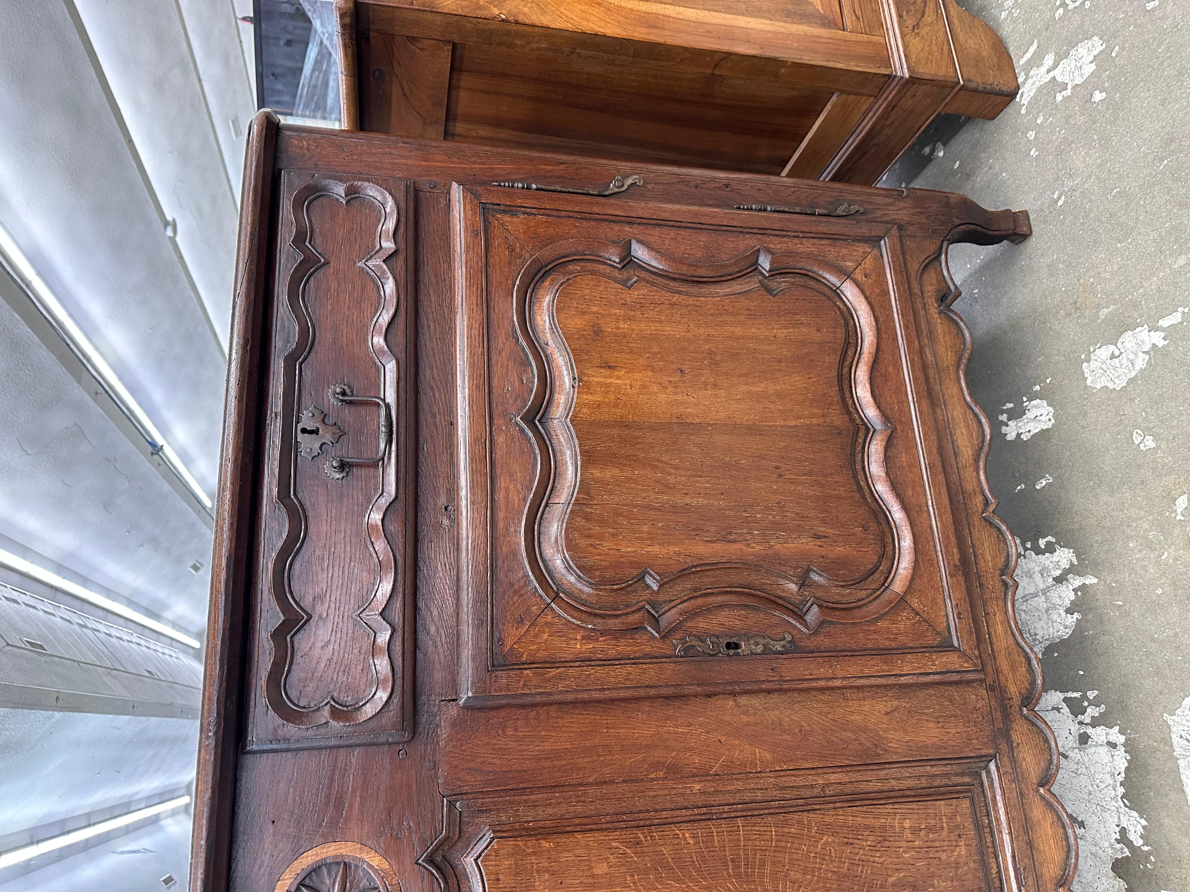 This is a truly stunning Louis XV period French Enfilade! Dating to the 1700s, this piece wears its age beautifully with an excellent patina. The front boasts such gorgeous handwork by the French craftsman as well has the iron workers that forged