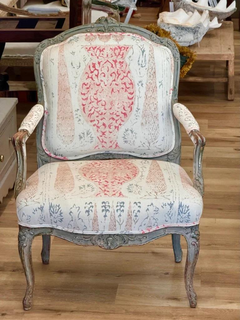 Louis XV Period carved, pale green polychrome beechwood Fauteuil, open armchair, having a floral crest and other foliate carving to the back with carved, scrolled arms and acanthus carving, the seat over a carved skirt on cabriole legs with floral