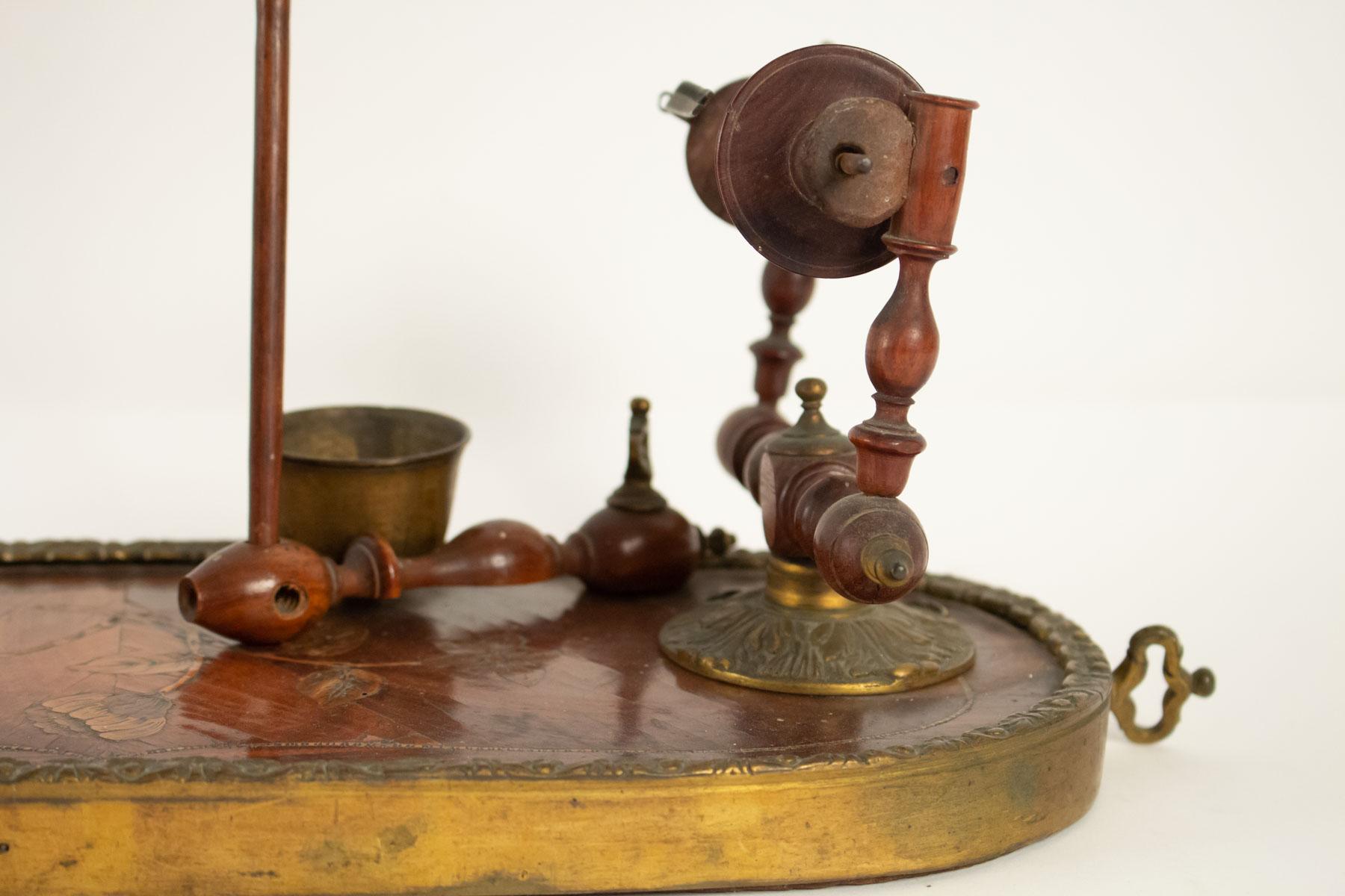 Period Louis XV spinning wheel in rose wood, violet wood, and gold gilt.
 