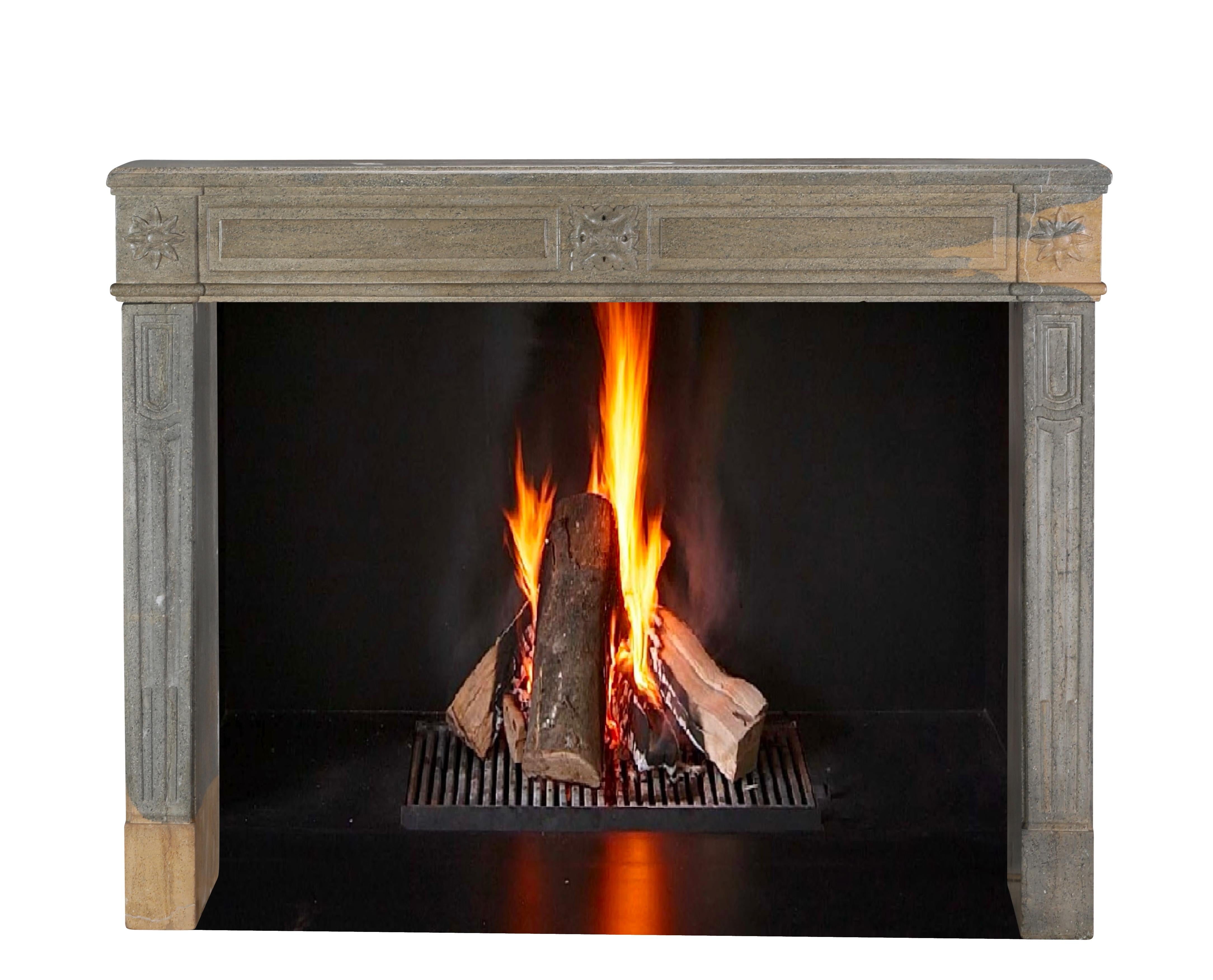 This exceptional period Louis XVI fireplace surround, meticulously sculpted in bicolor hard stone, embodies the refined artistry of the late 18th century.
Its harmonious blend of contrasting stone tones enhances its classical design, characterised