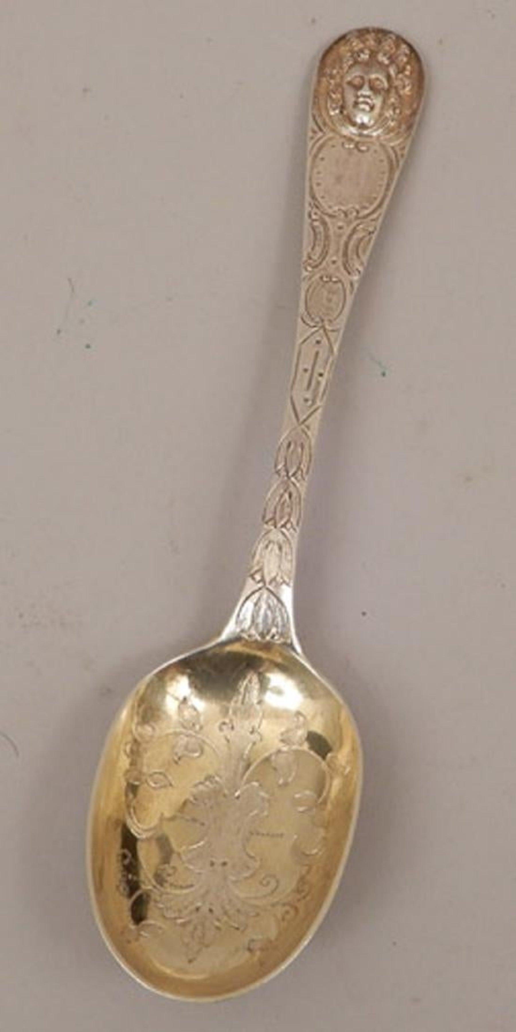 Period Louis XVI sterling table spoon, Paris, 1789
A tour de force of the Louis XVI style with applied medallion handle. The oval flat edge gold-washed bowl is engraved with leaf and vine decoration.
Bearing hallmark of crown above P/89, a