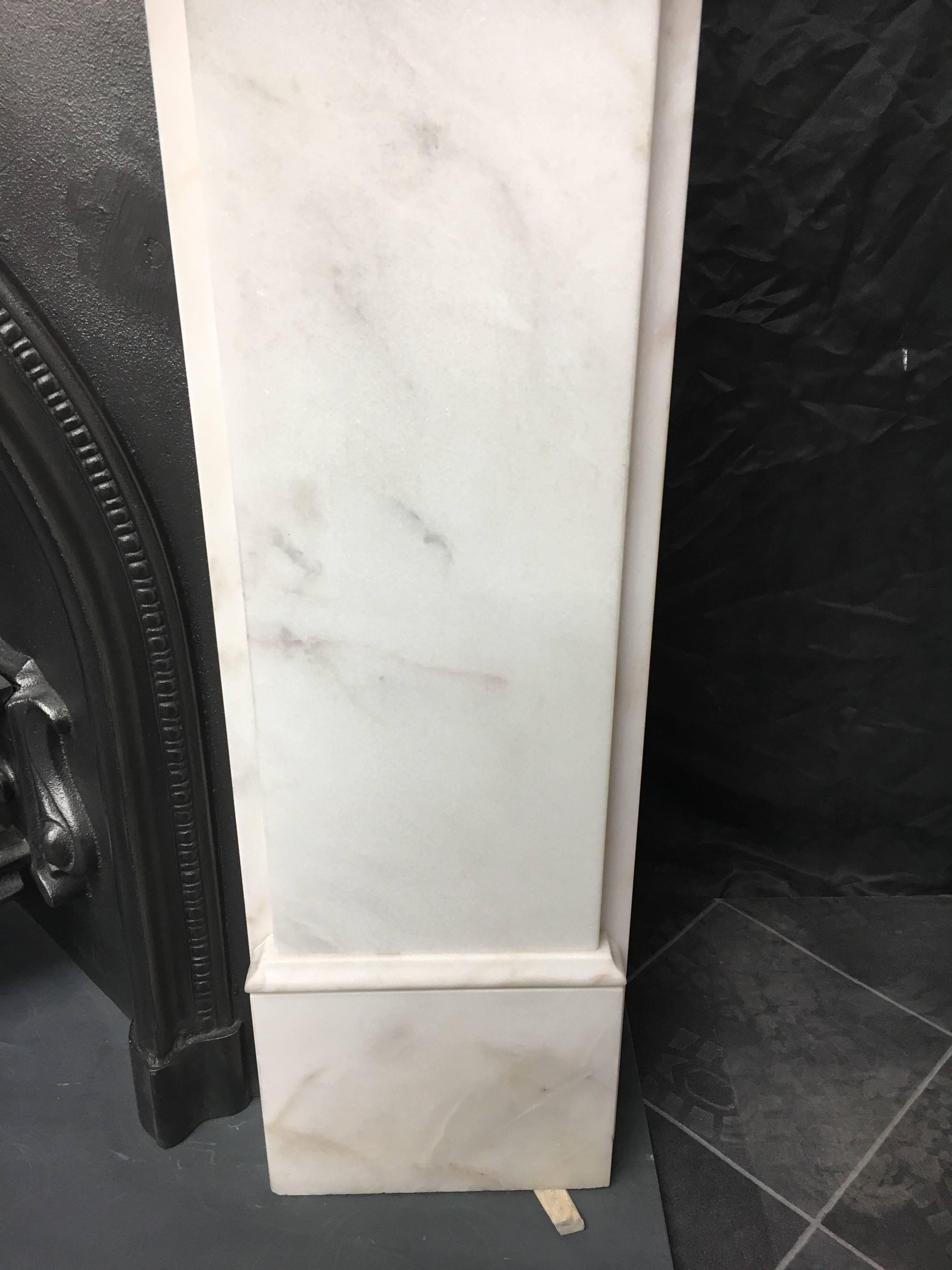 A fine marble period corbel fireplace surround complete with its original London arch cast iron interior insert. A timeless classic combination.
English, circa 1960

Fireplace opening: 900mm wide x 950mm high.