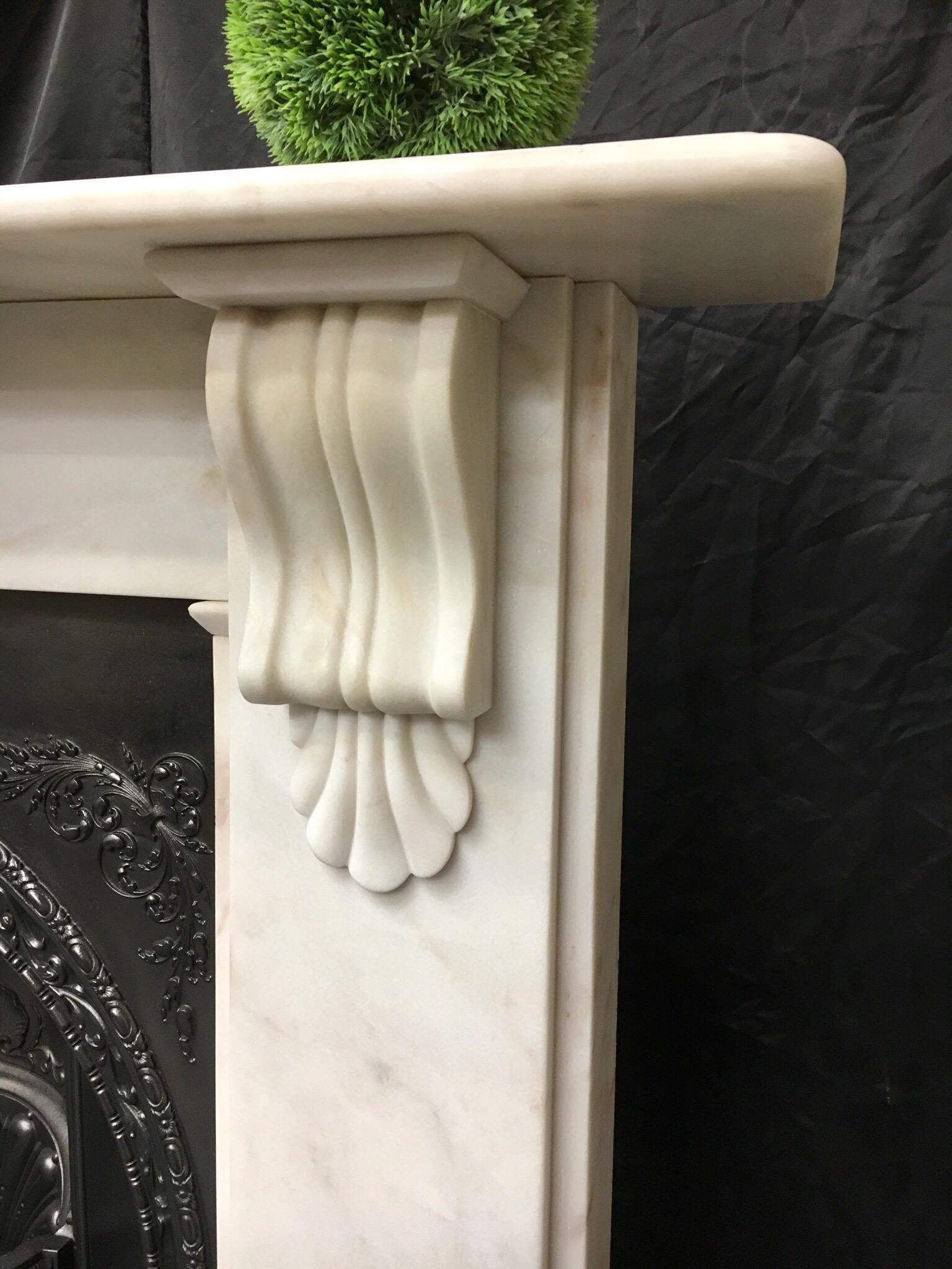 A period light marble corbel fireplace surround complete with its cast iron London arch insert. Fully restored and ready to install.
Fireplace opening size: 900mm wide x 950mm high.
Width is adjustable.