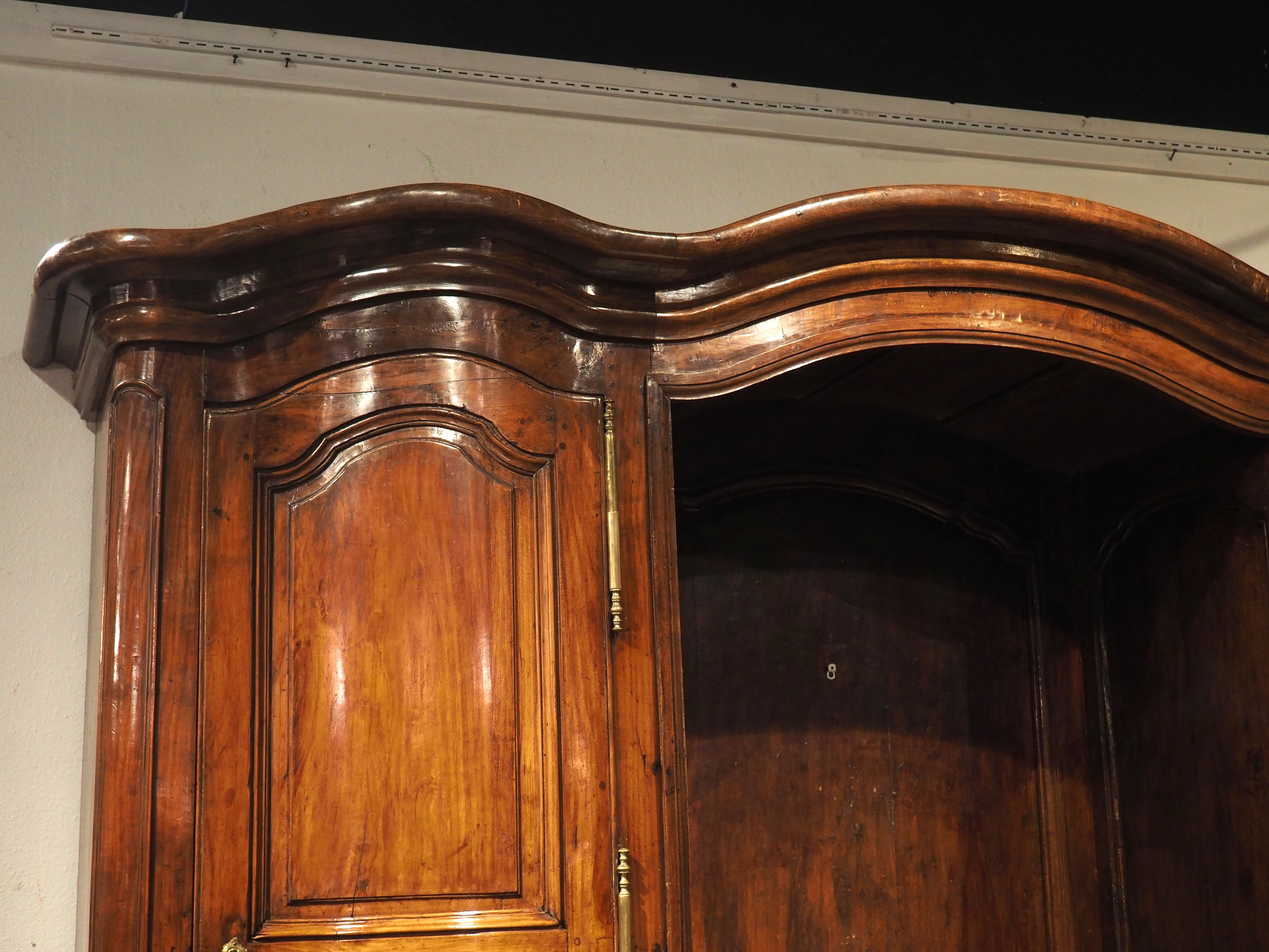 Known in France as a buffet de boiserie, this magnificent period Regence buffet would have been built in the early 1700s. The thick and luscious moldings of this unique piece of furniture have retained a deep and rich patina during the past three